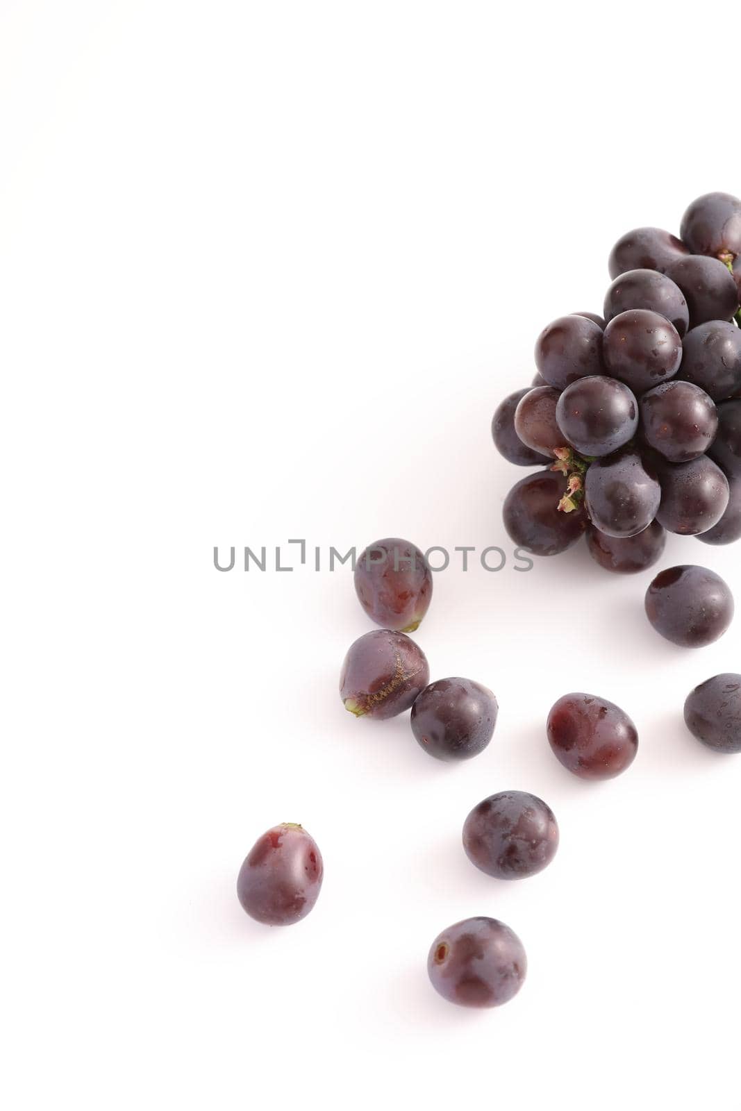 Red grapes isolated in white background by piyato