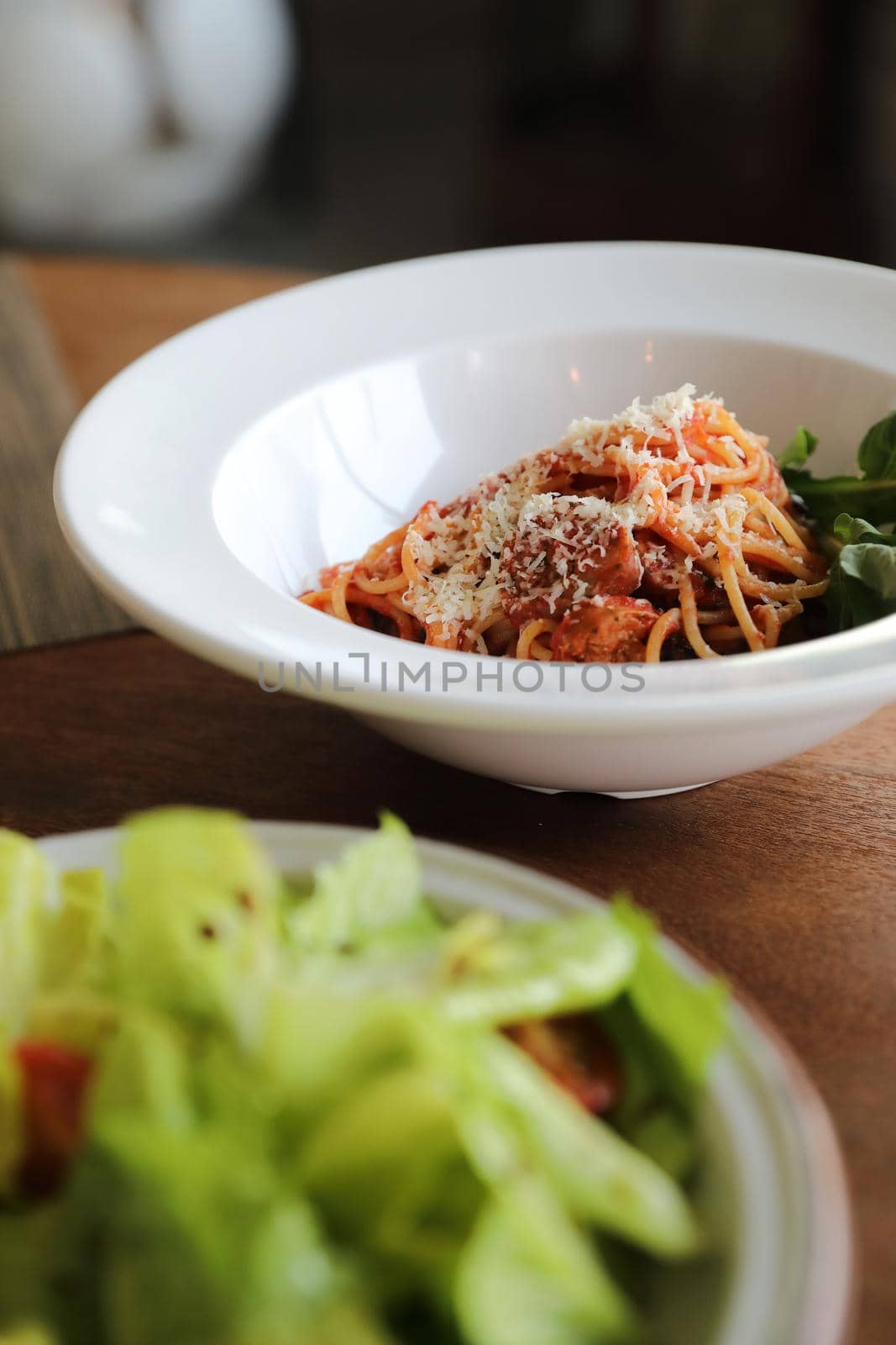 spaghetti Bolognese with italian sausage and tomato sauce with parmesan cheese and basil  by piyato