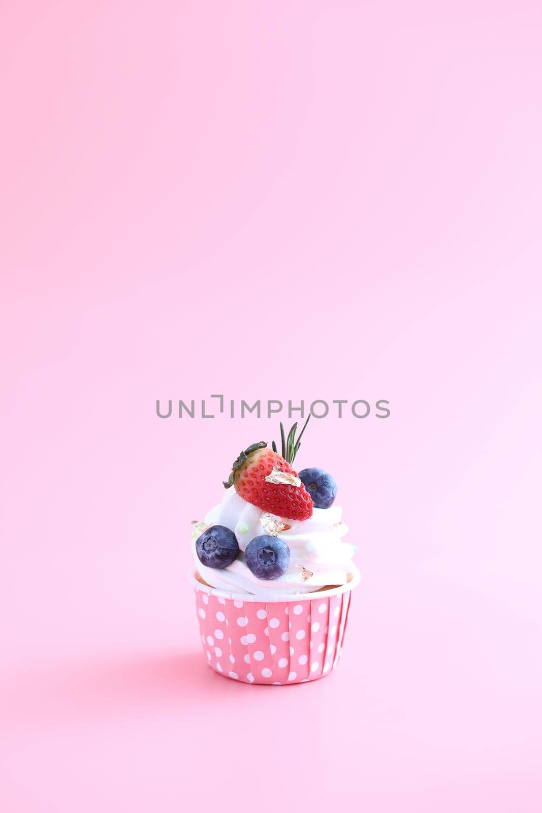 Fruits cupcake isolated in pink background