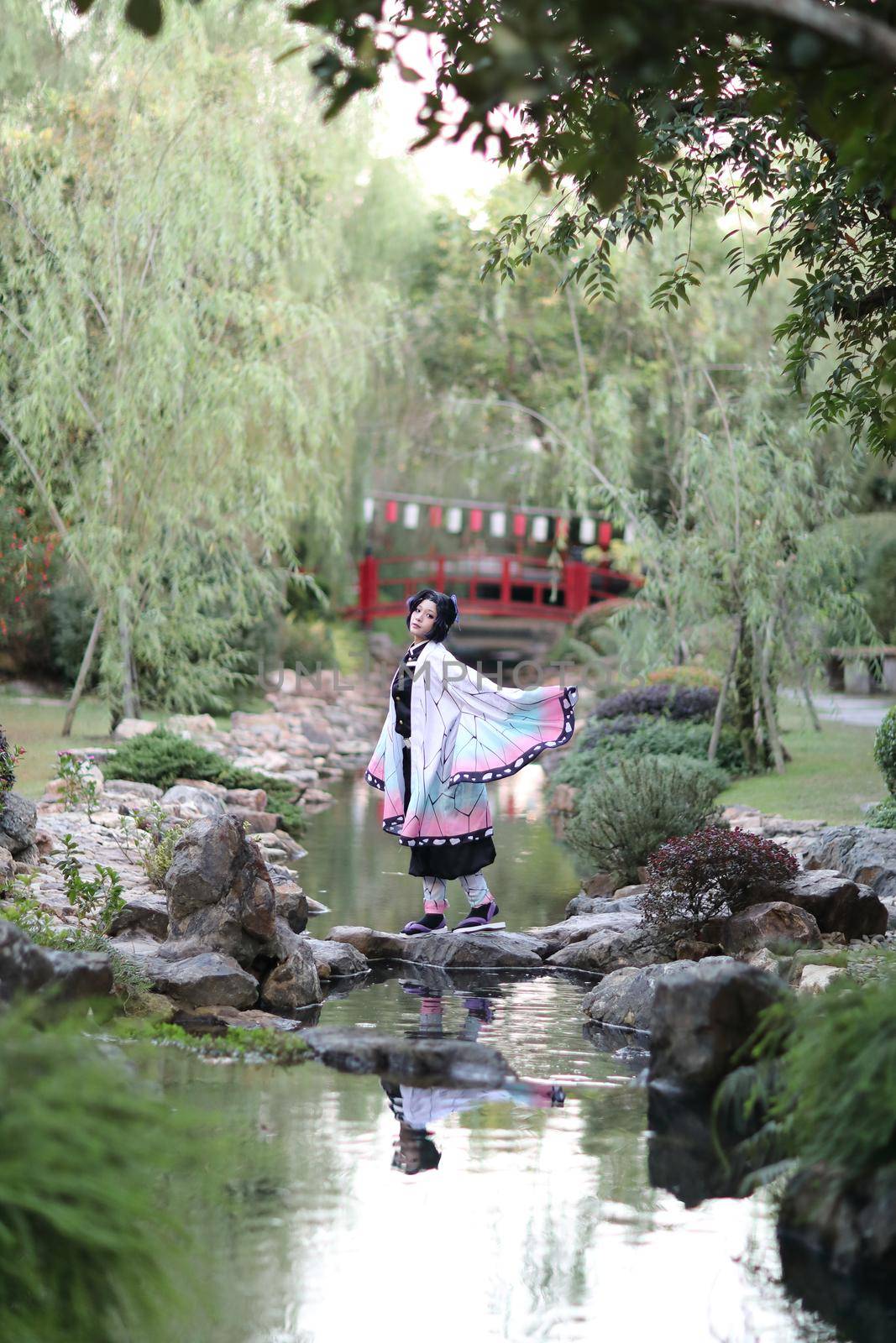 Japan anime cosplay portrait of girl with comic costume with japanese theme garden by piyato