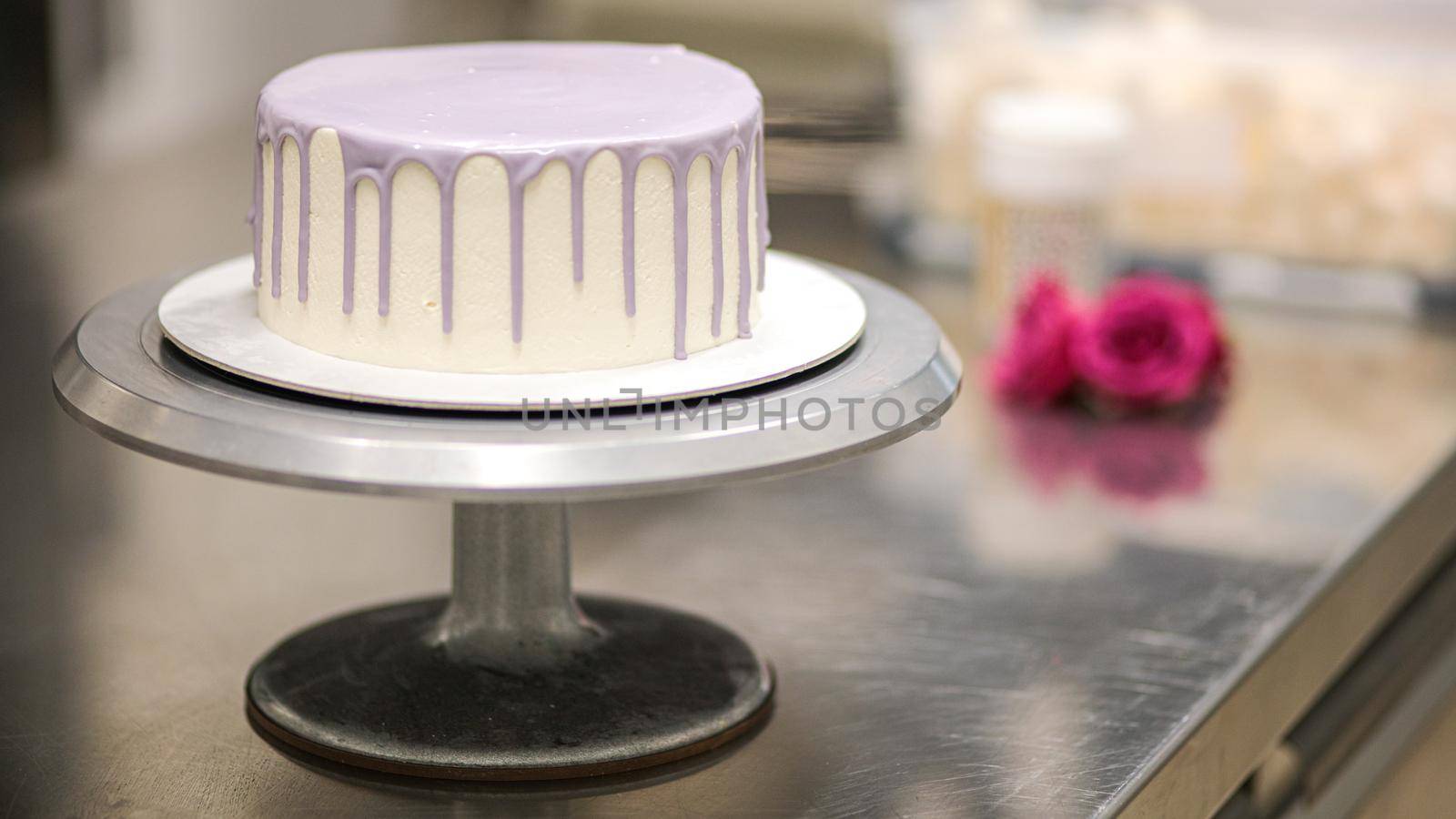 White lilac blank butter cream Frosted cake ready to decorated by cake desginer by verbano