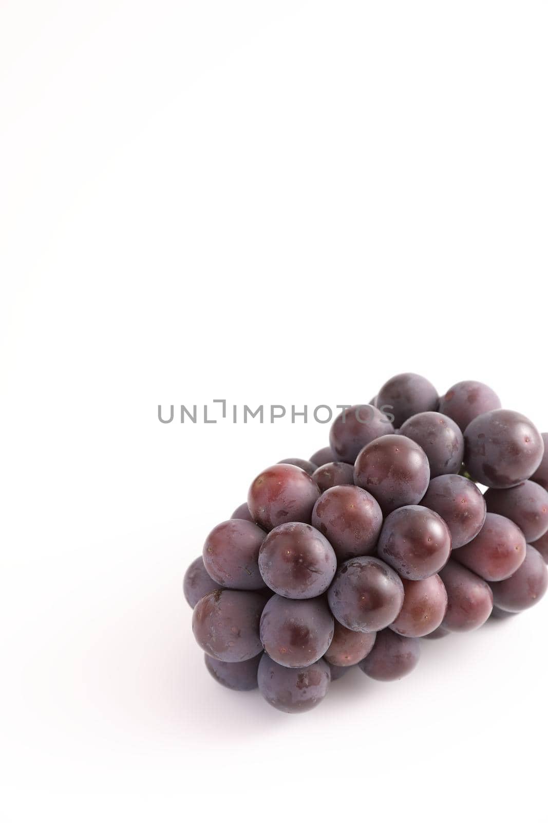 Red grapes isolated in white background