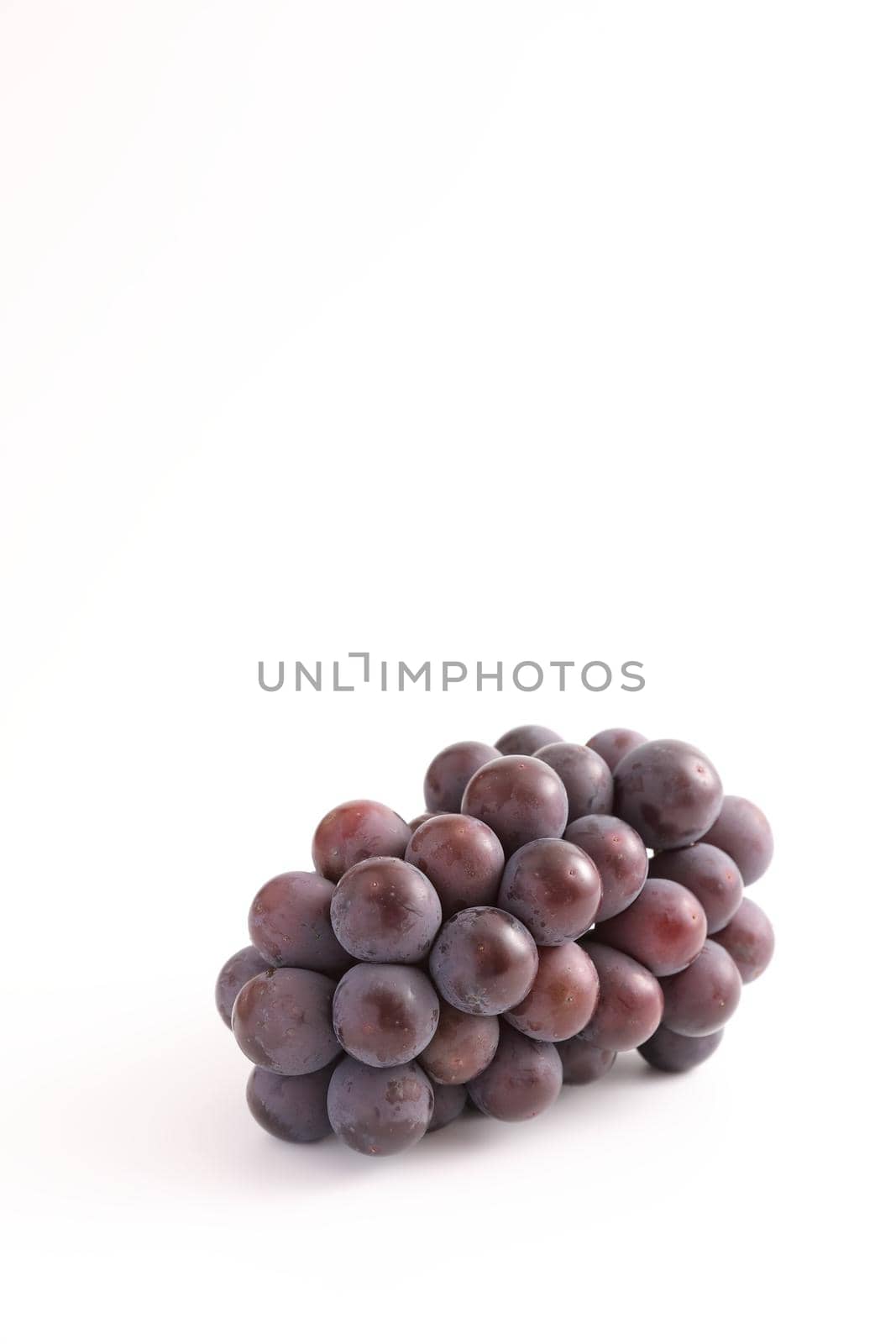 Red grapes isolated in white background