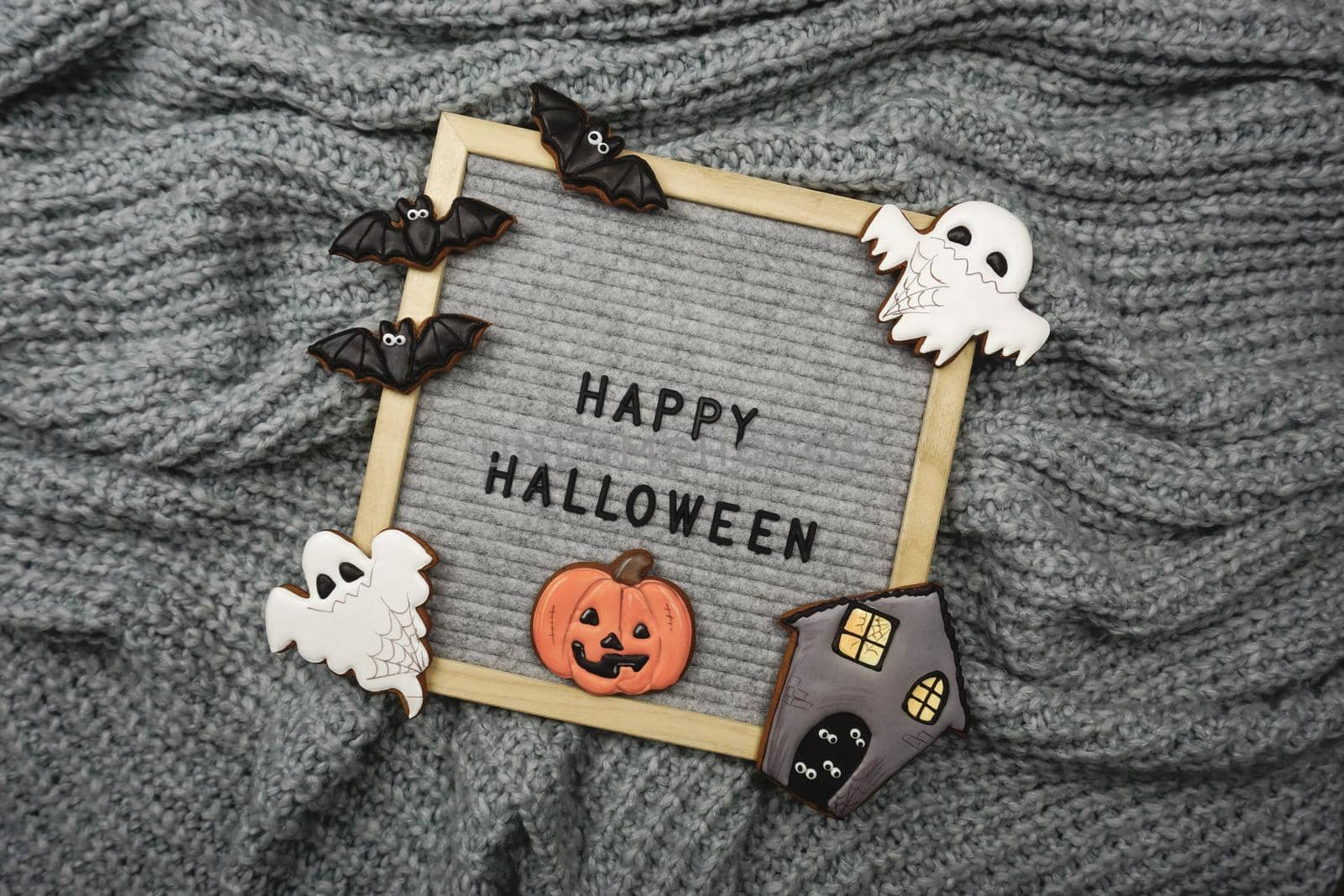 The text is written in the frame - Happy Halloween and there are gingerbread cookies by Spirina