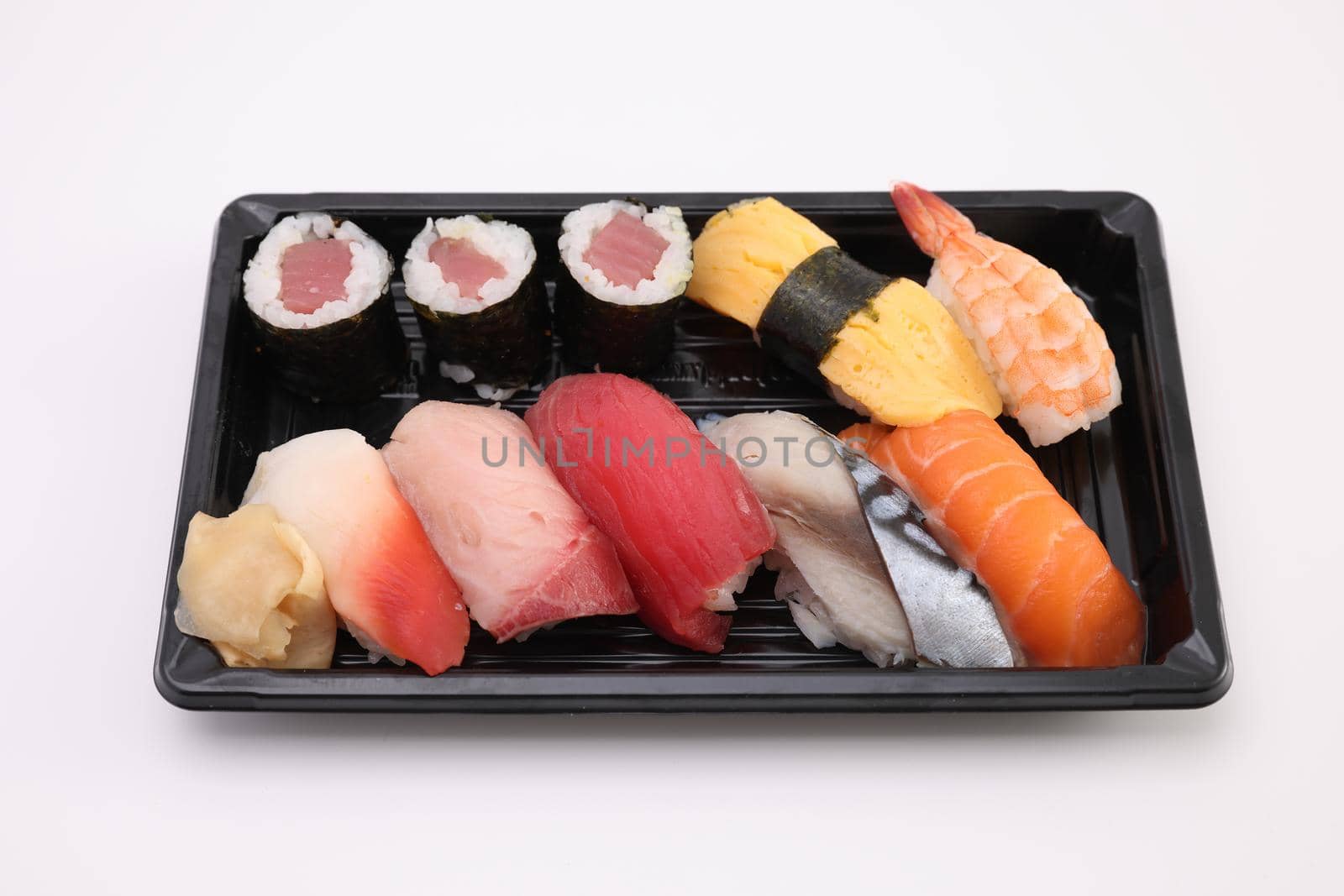 Sushi Set nigiri and sushi rolls with soy sauce and chopsticks Japanese food isolated in white background