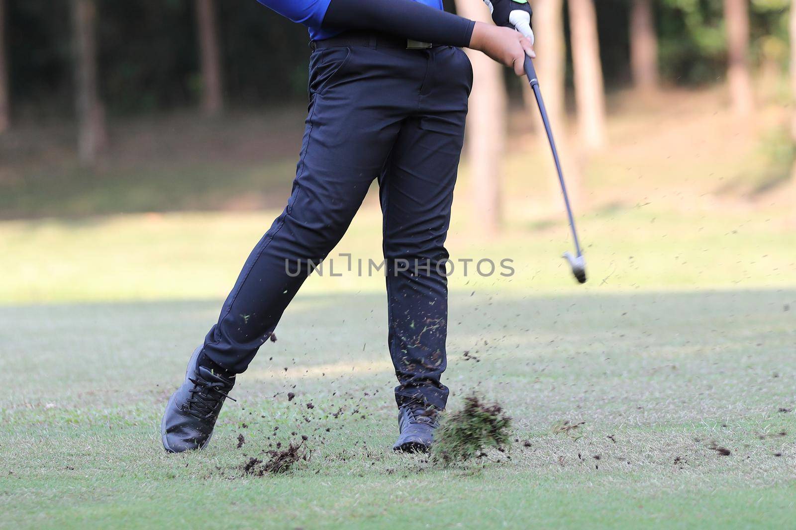 Young male golfer player on golf course by piyato