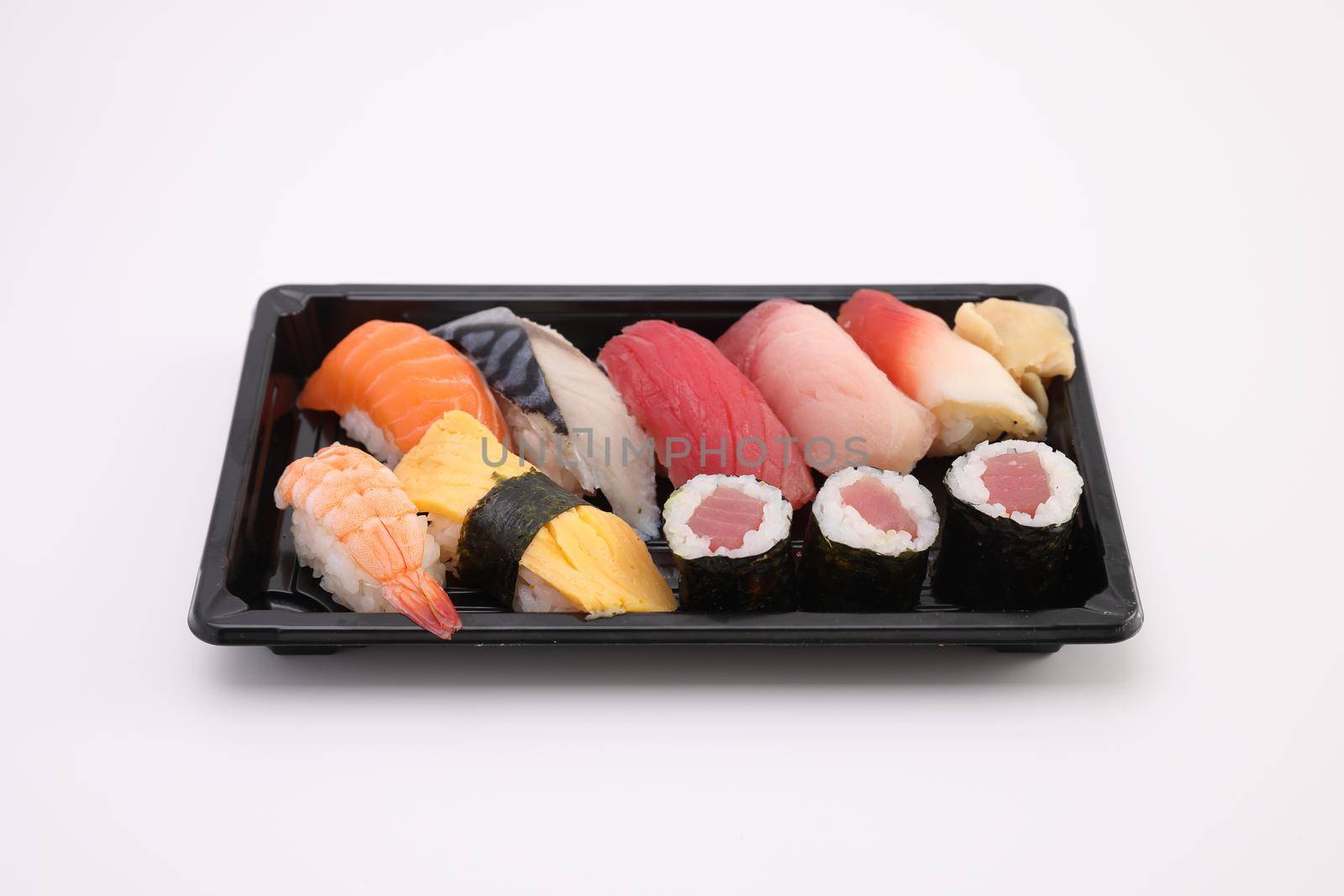 Sushi Set nigiri and sushi rolls with soy sauce and chopsticks Japanese food isolated in white background