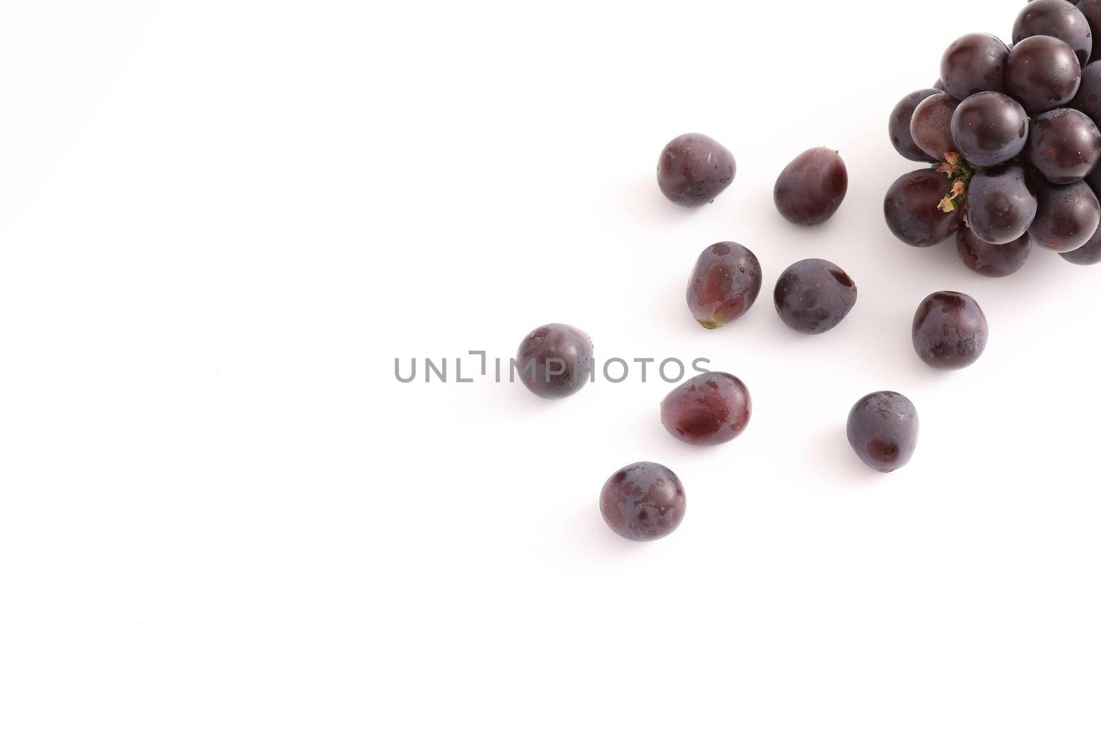 Red grapes isolated in white background