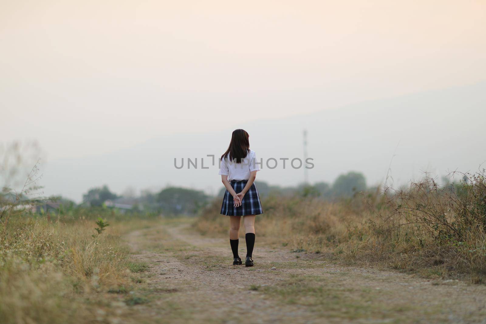 beautiful asian japanese school girl uniform looking at park outdoor 