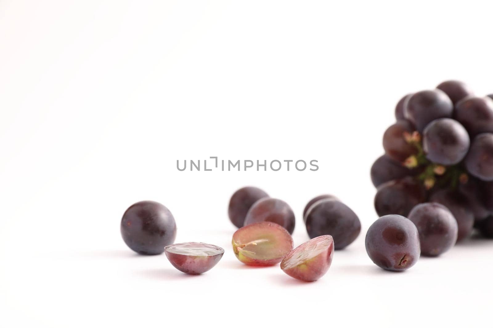 Red grapes isolated in white background by piyato