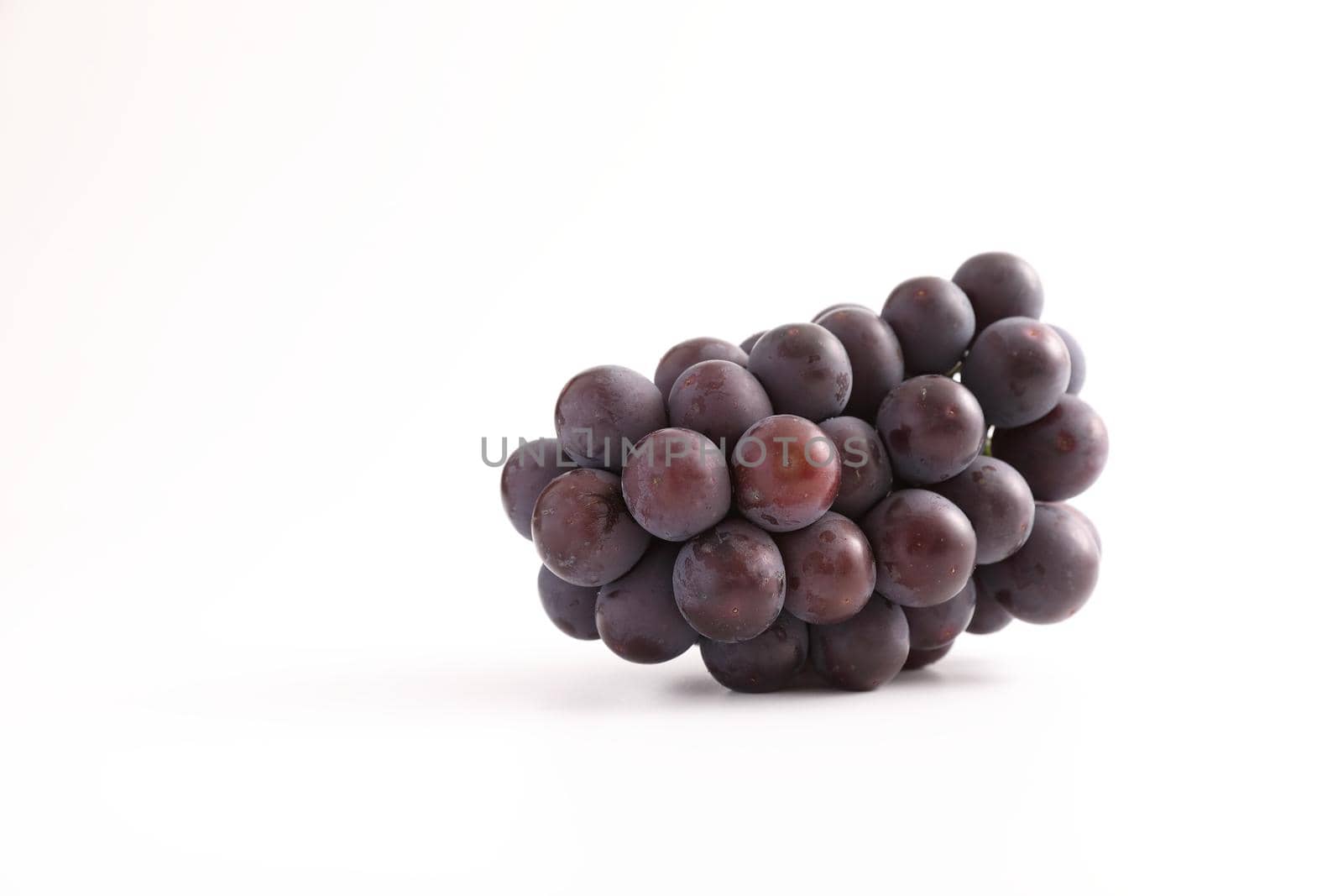 Red grapes isolated in white background