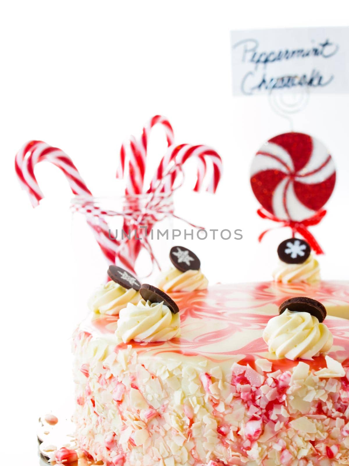 Traditional Christmas White Chocolate Peppermint Cheesecake on white background.