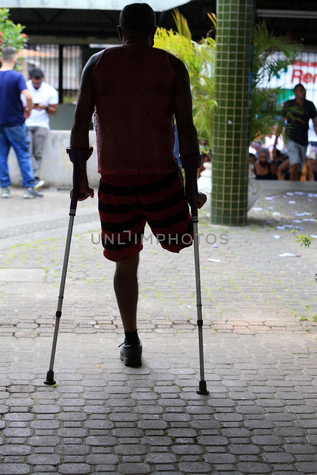 salvador, bahia, brazil - october 2, 2022: person using crutch seen in a voting section of a public school for general elections in the city of Salvador