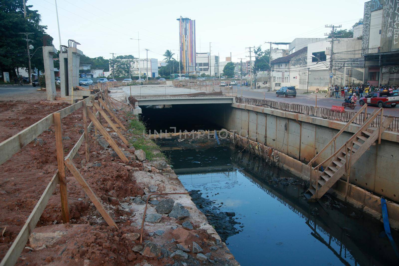 salvador, bahia, brazil - july 29, 2022: construction of sewage pipeline exclusive way for BRT transport system in the Lucaia canal region in the city of Salvador.