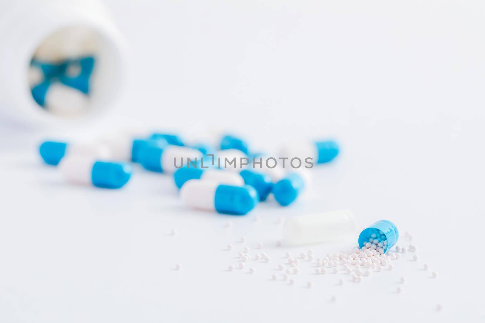 pills capsules with bottle isolated in white background