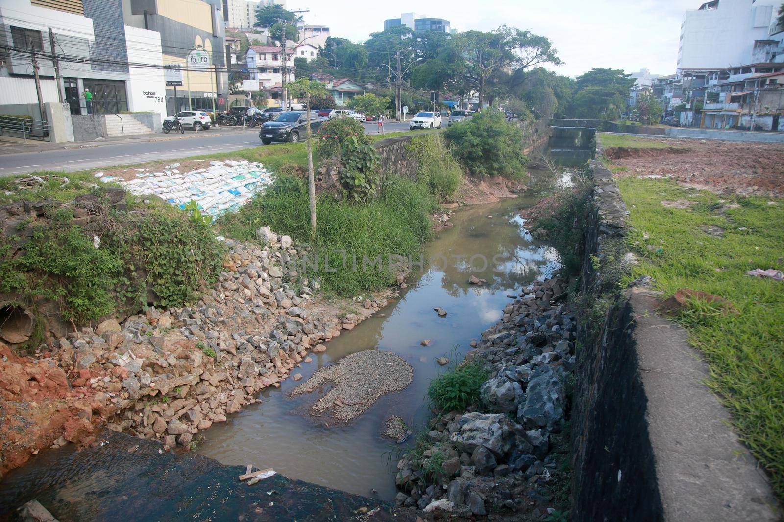salvador, bahia, brazil - july 29, 2022: construction of sewage pipeline exclusive way for BRT transport system in the Lucaia canal region in the city of Salvador.
