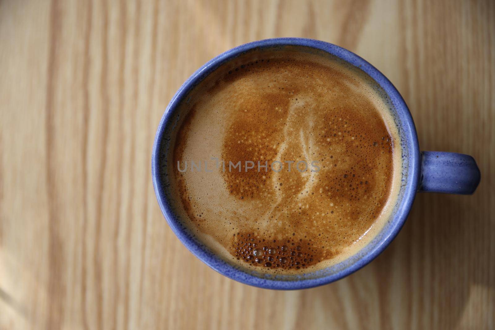 Cappuccino coffee on wood background