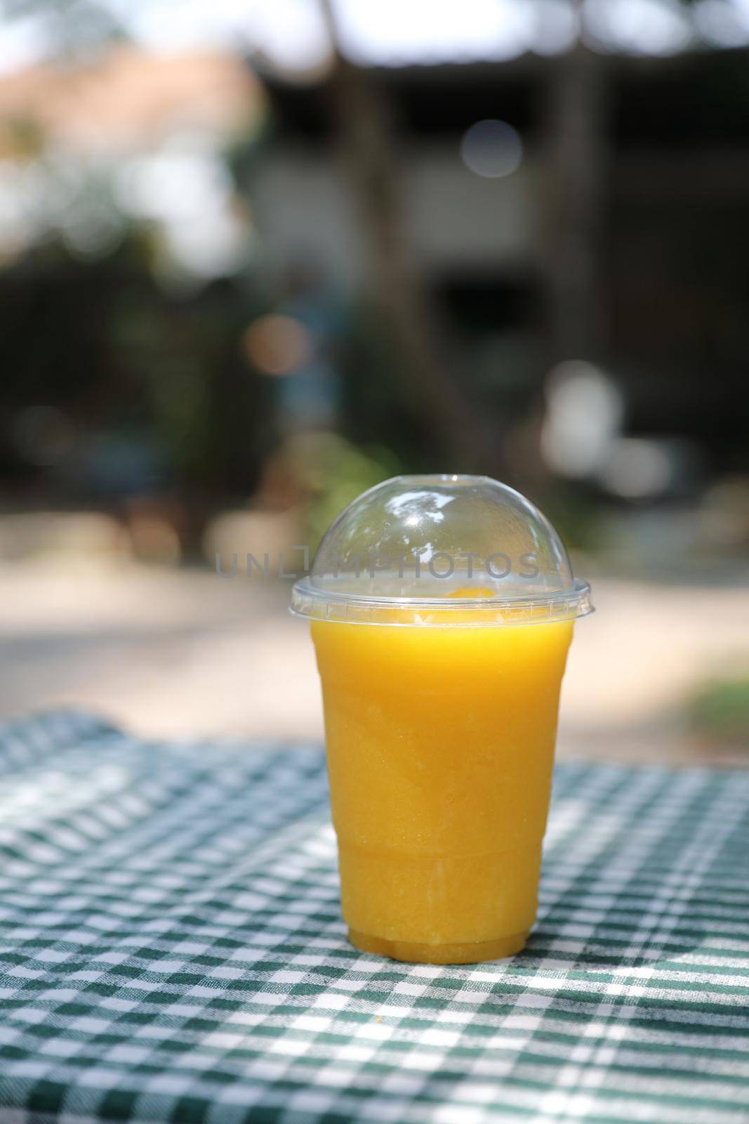 Mango smoothie milk shake with take out glass by piyato