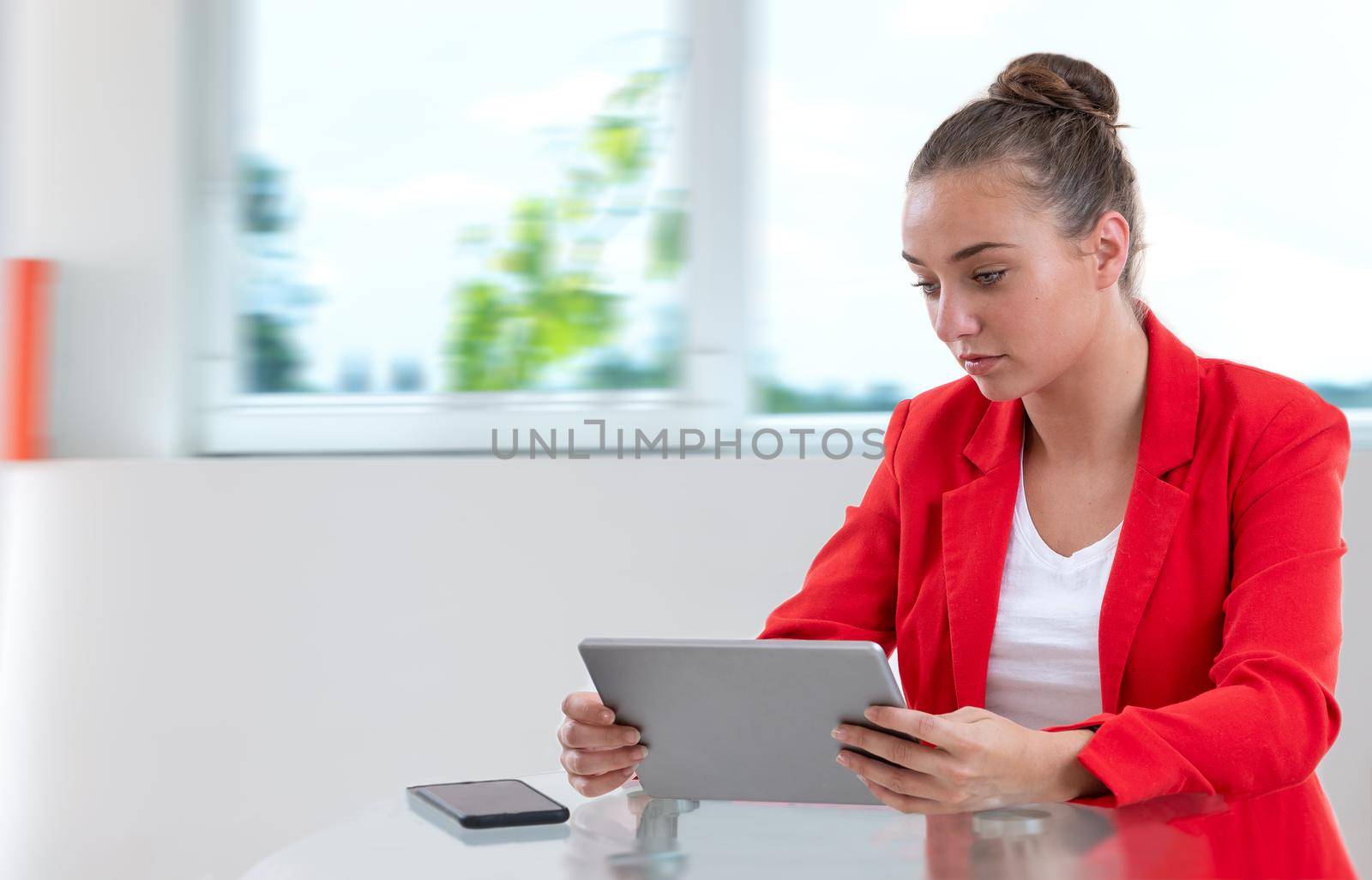 Young woman reading her messages.