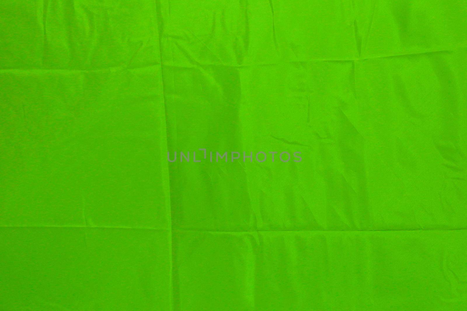 Abstract green lined fabric background with pleat marks. by gelog67