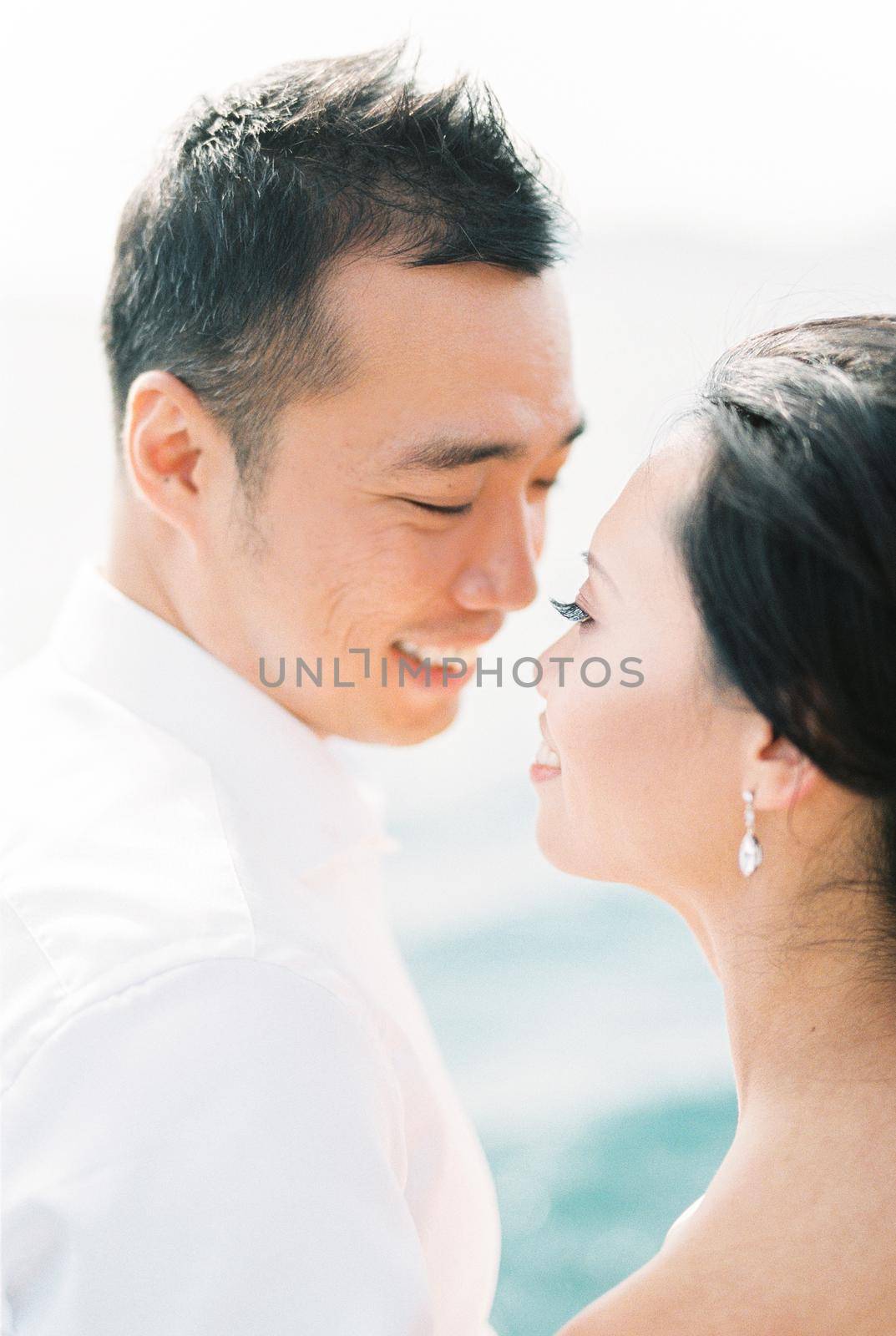 Smiling man and woman tilted their faces towards each other. Portrait. High quality photo