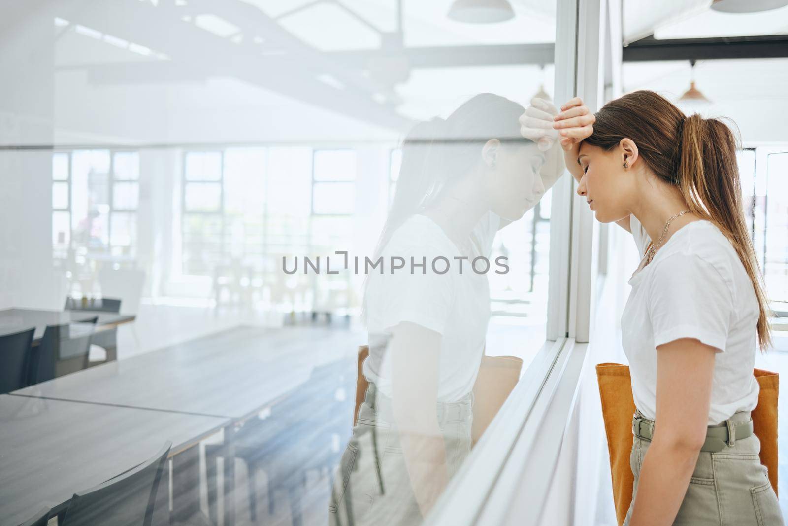Burnout, frustrated and sad student by classroom window for fail, mistake or bad time management with mental health problem. Depressed, tired and fatigue college woman with study headache university by YuriArcurs