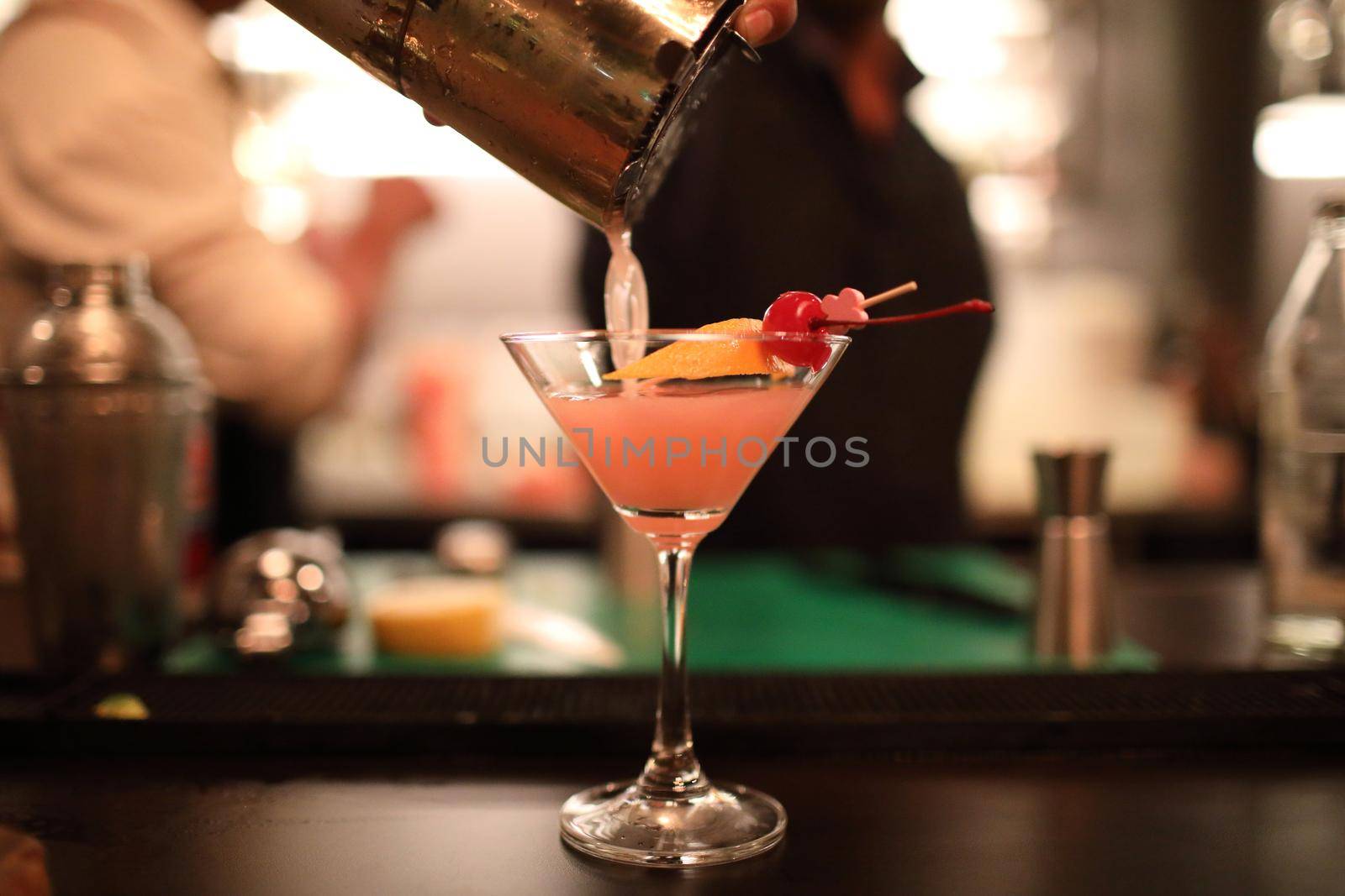 cocktails in glasses on bar counter in pup or restaurant