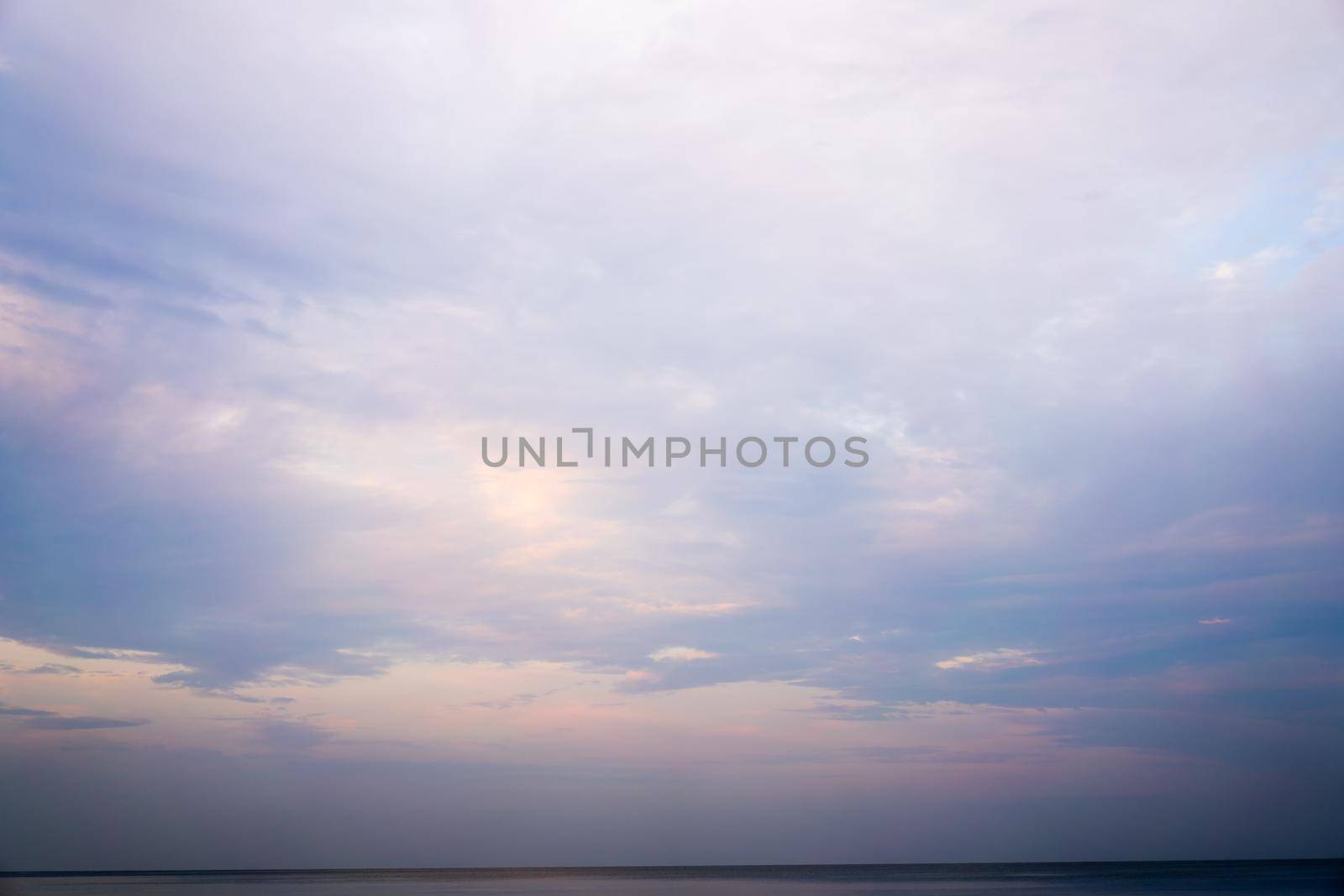 Beautiful dramtic cloudy sky sunset background under sea water With yellow orange colors