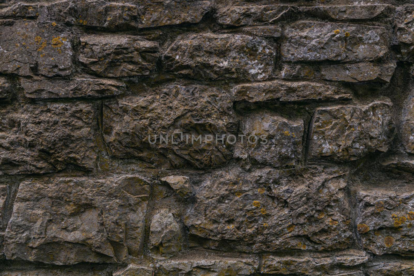 Old castle stone wall texture background texture. High-quality photo