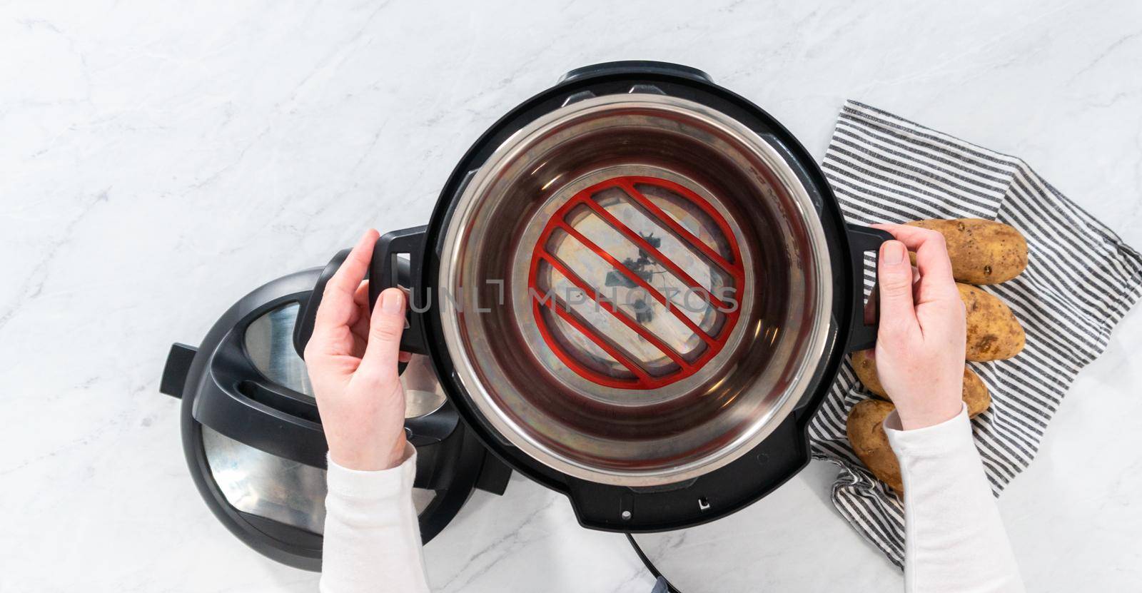 Flat lay. Pressure Cooker Baked Potatoes. Cooking whole potatoes in a pressure cooker to make baked potatoes.