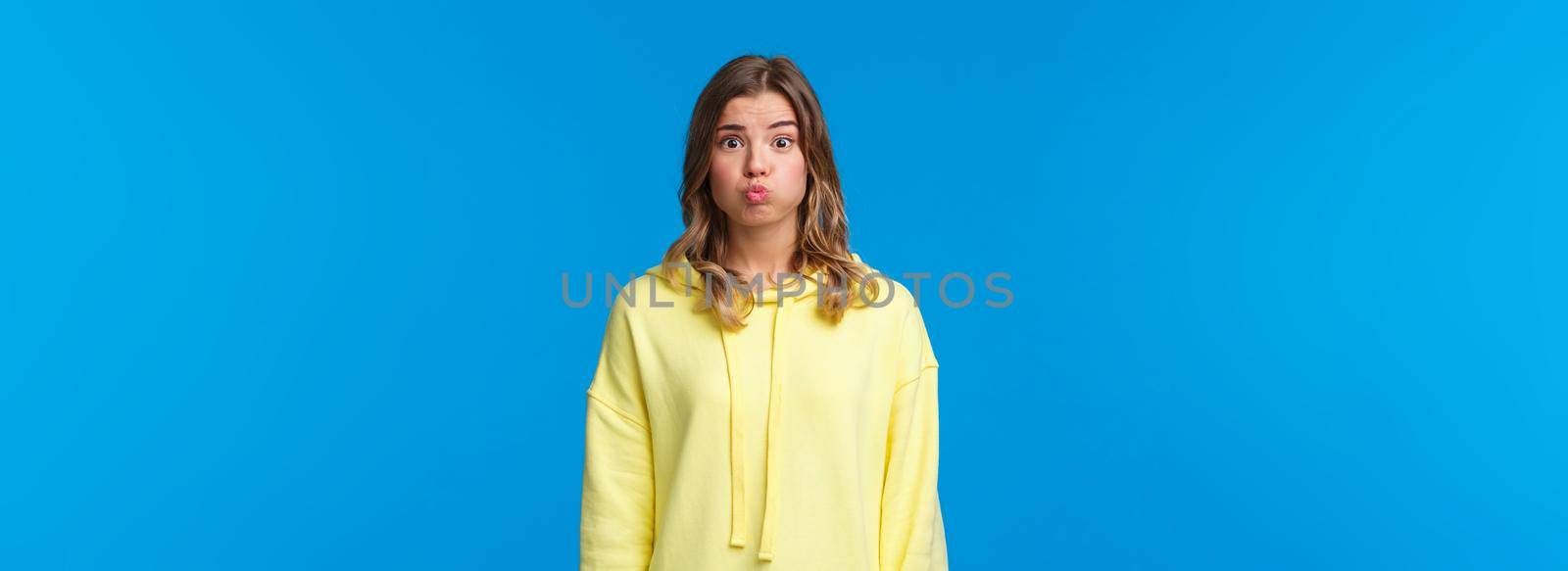 Silly and cute blond female pouting, hold her breath as promise being silent, dont tell anyone what happened or hiding secret, standing blue background, cant say anything by Benzoix