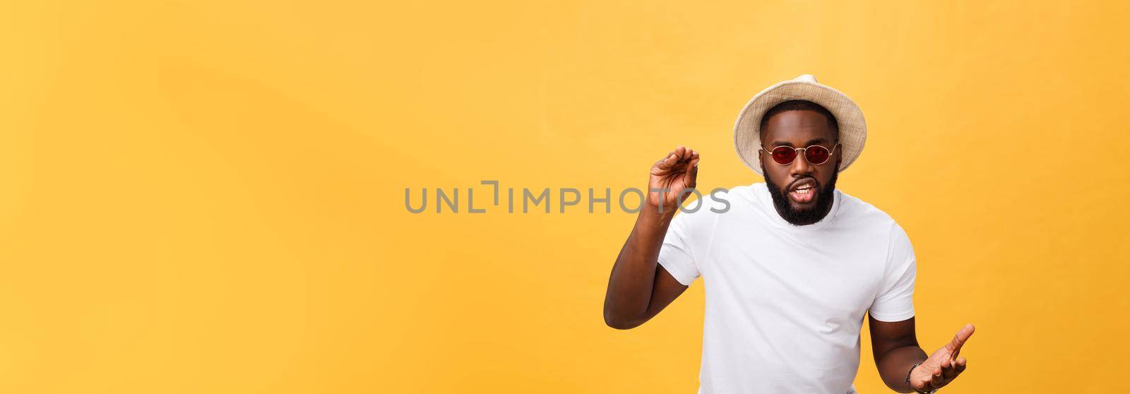 Young african american man wearing white t-shirt shouting and screaming loud to side with hand on mouth. Communication concept