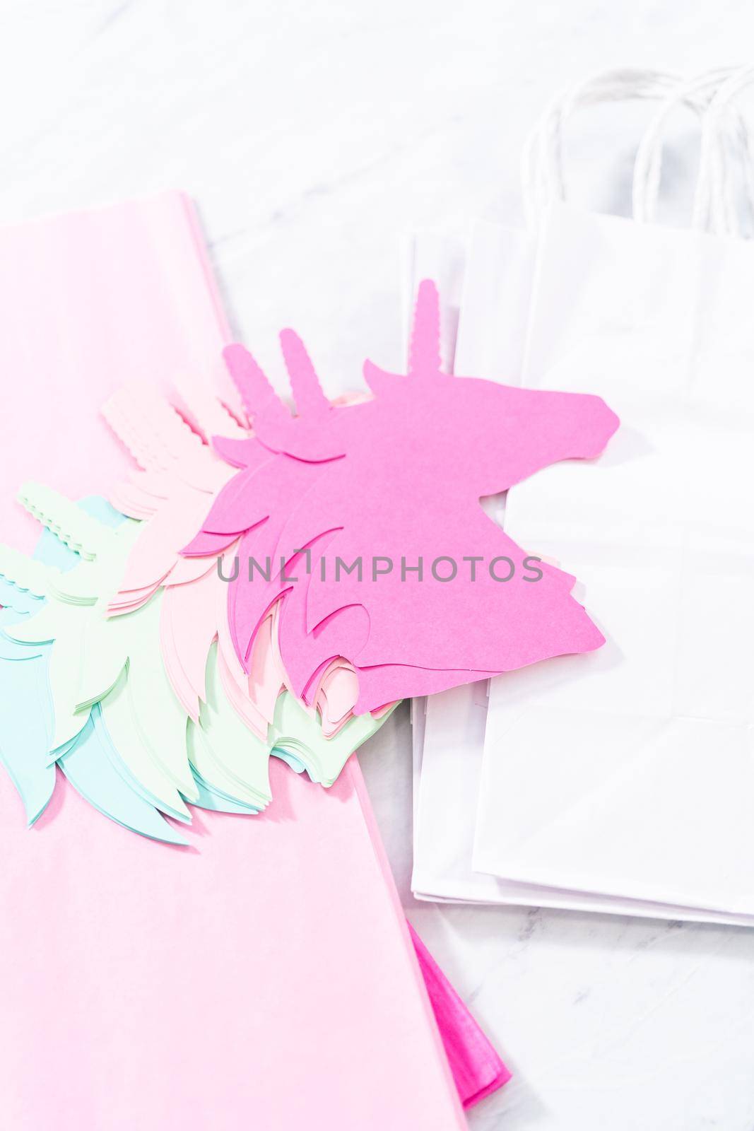 Materials to make unicorn Birthday party favor bags for a little girl's Birthday party.