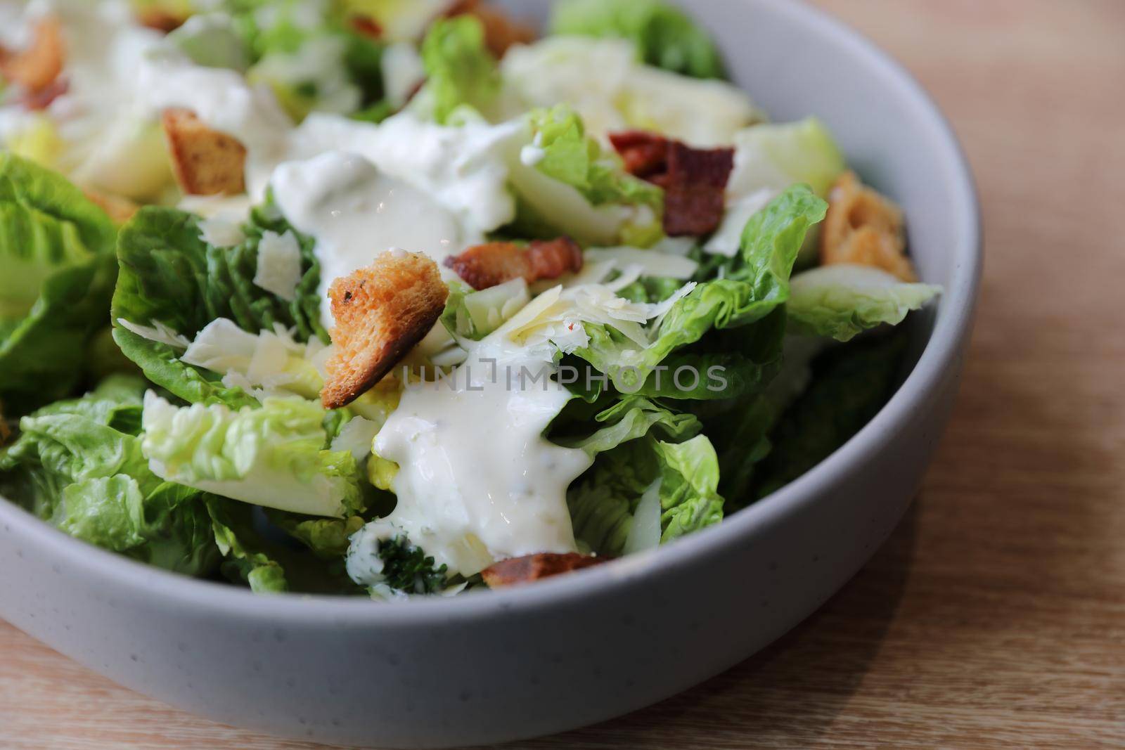 caesar salad appetizer on wooden background