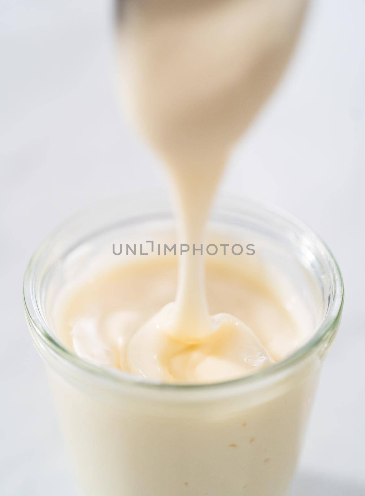 Cream cheese glaze in small glass jat.