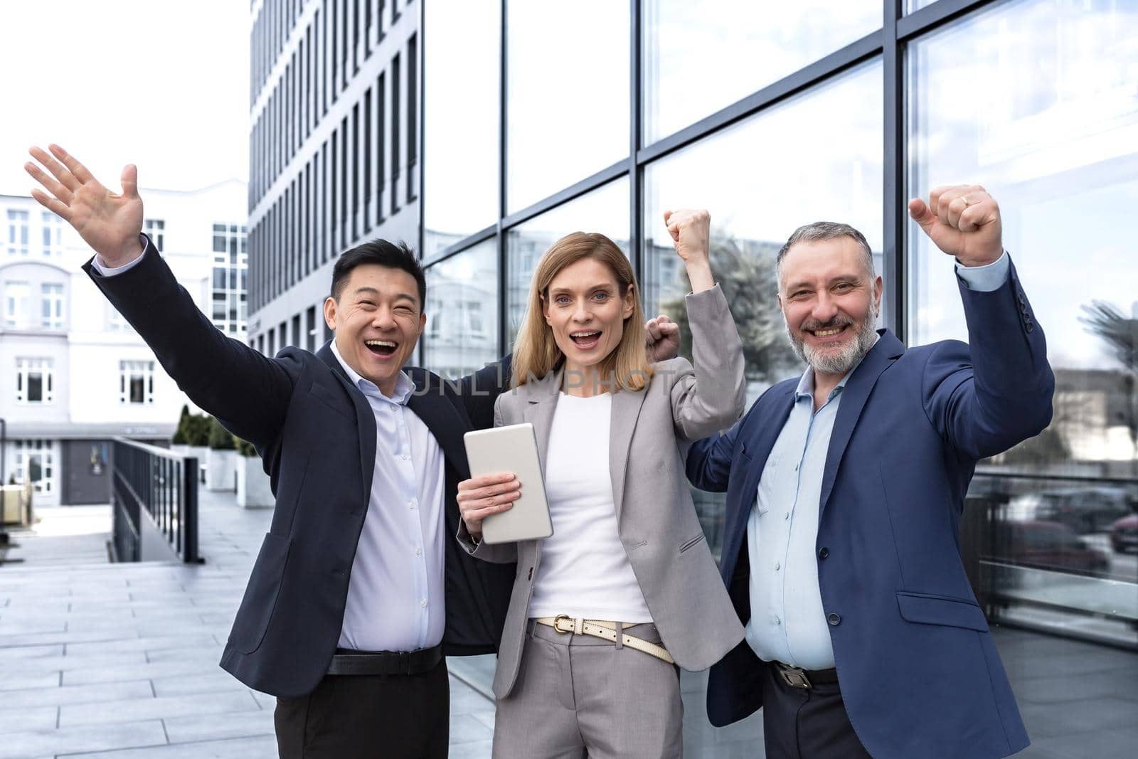 Success Happy Group business people excited rejoicing looking at camera after successful completion project, and smiling Portrait diverse team employees celebrating victory.