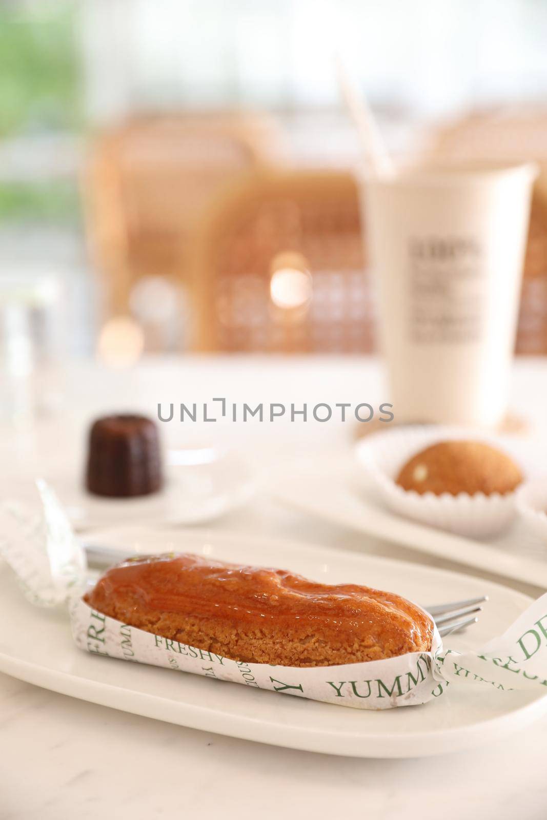 croquant choux cream japanese dessert in coffee shop background by piyato