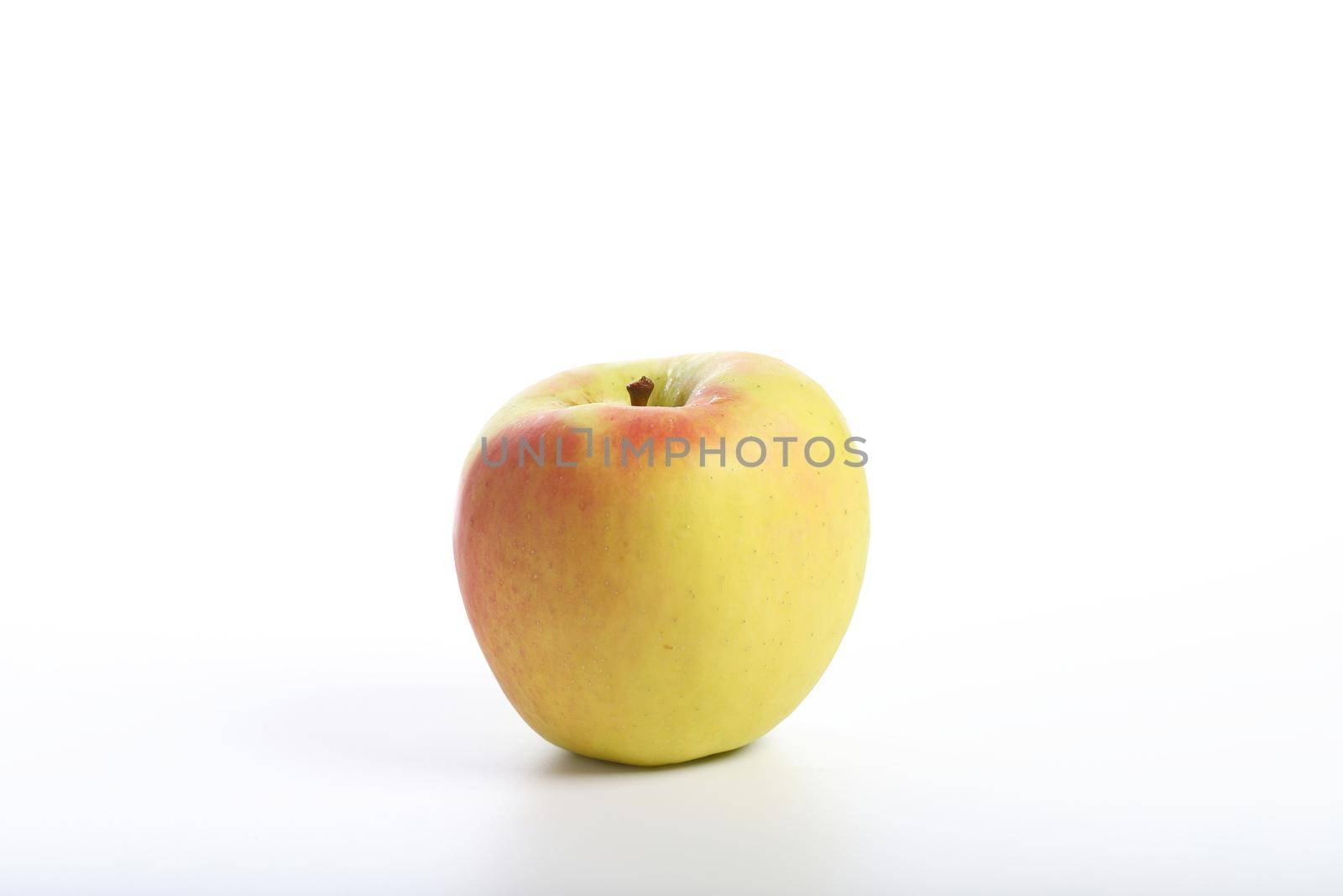 Red yellow apple isolated in white background by piyato