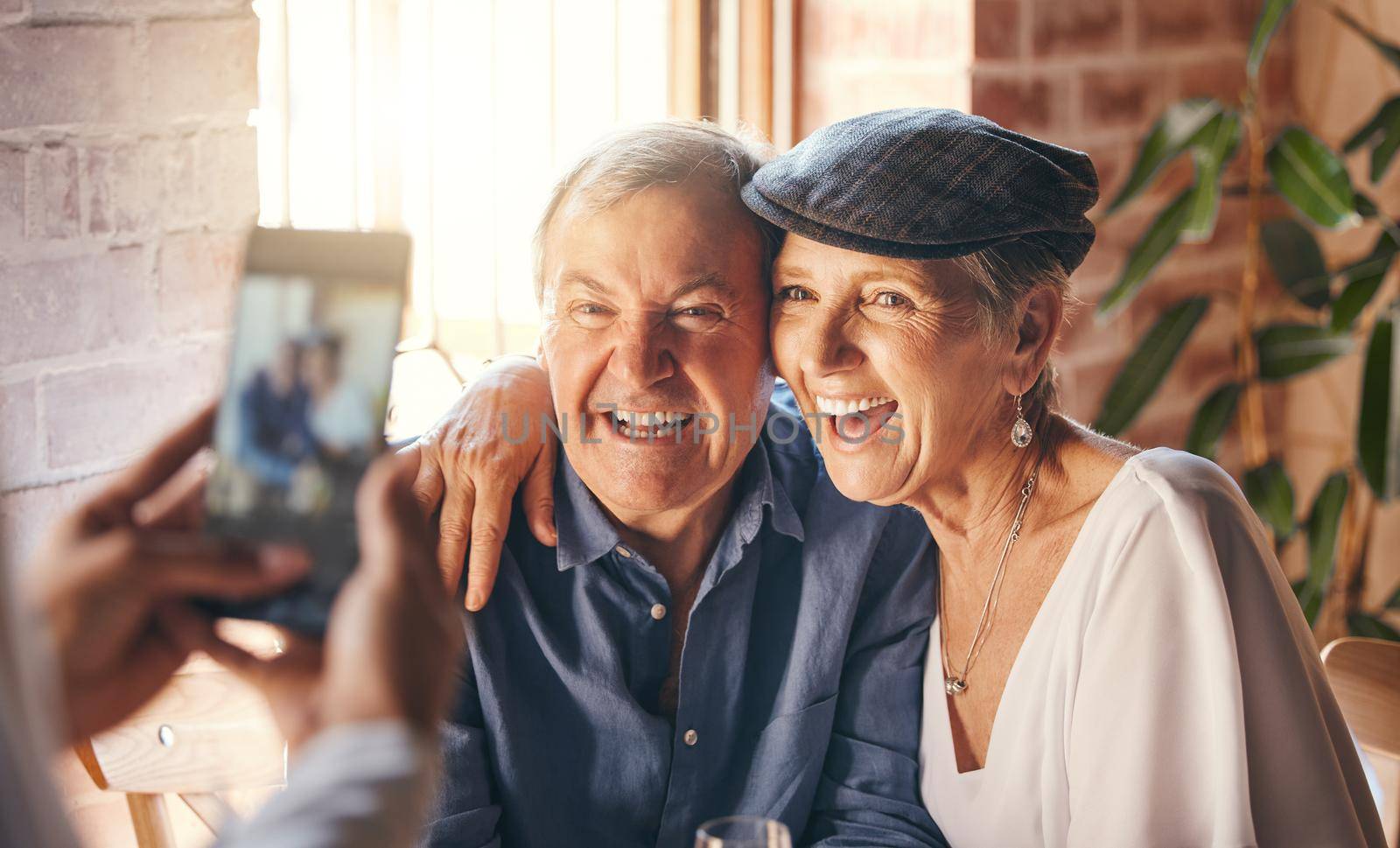 Hands, phone and photography of senior couple smile together for joy, happiness and relationship love. Elderly, retired and married man and woman smiling, excited and happy for digital mobile photo by YuriArcurs