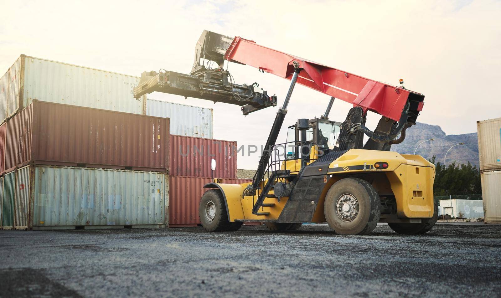 Shipping container, logistics crane truck and supply chain distribution port in freight export industry. Industrial site with transportation for storage, delivery loading and global ecommerce work by YuriArcurs