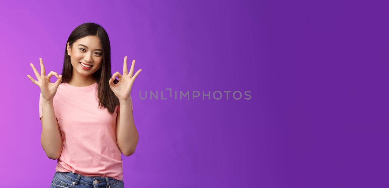 Friendly joyful good-looking stylish asian girl brunette show okay accept sign, smiling delighted feel fine, give recommendation, approve nice choice, stand purple background satisfied.