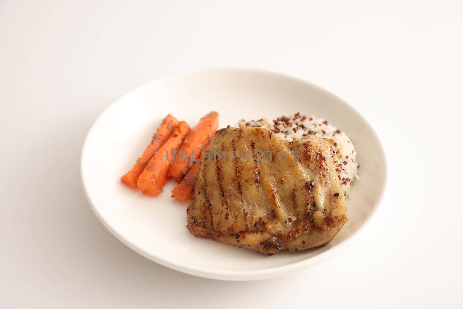 Grilled chicken with rice isolated in white background