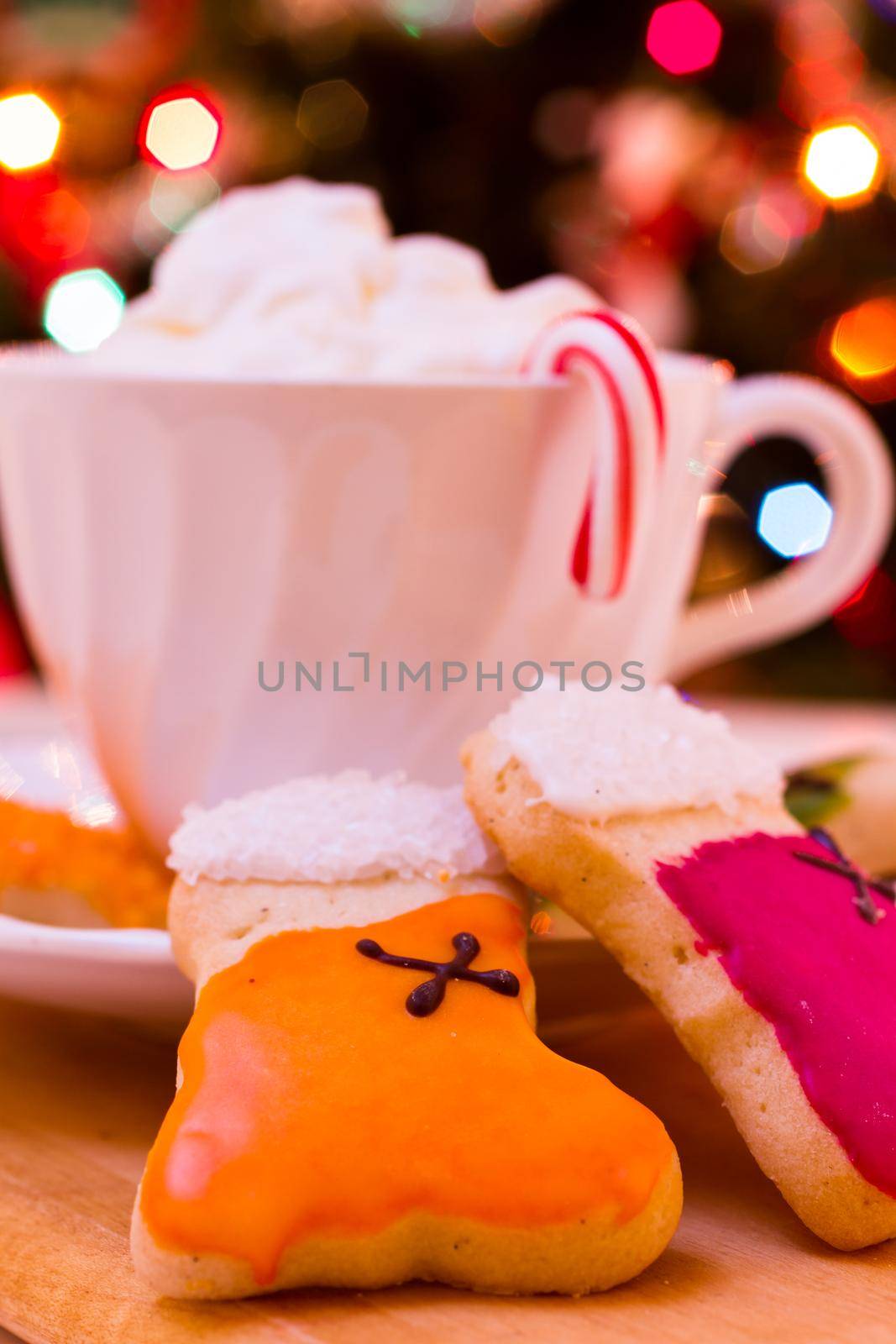 Colorful Christmas sugar cookies with hot chocolate.