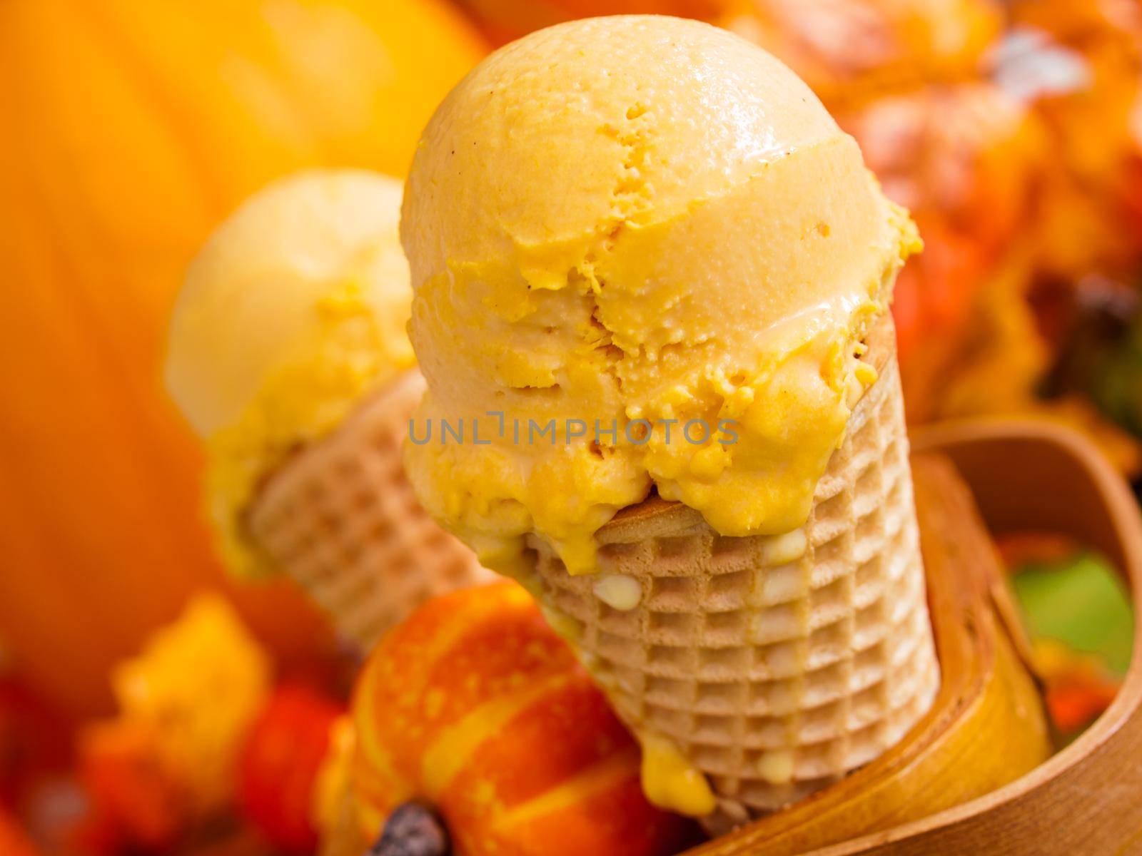Scoop of gourmet pumpkin gelato in waffle cones.