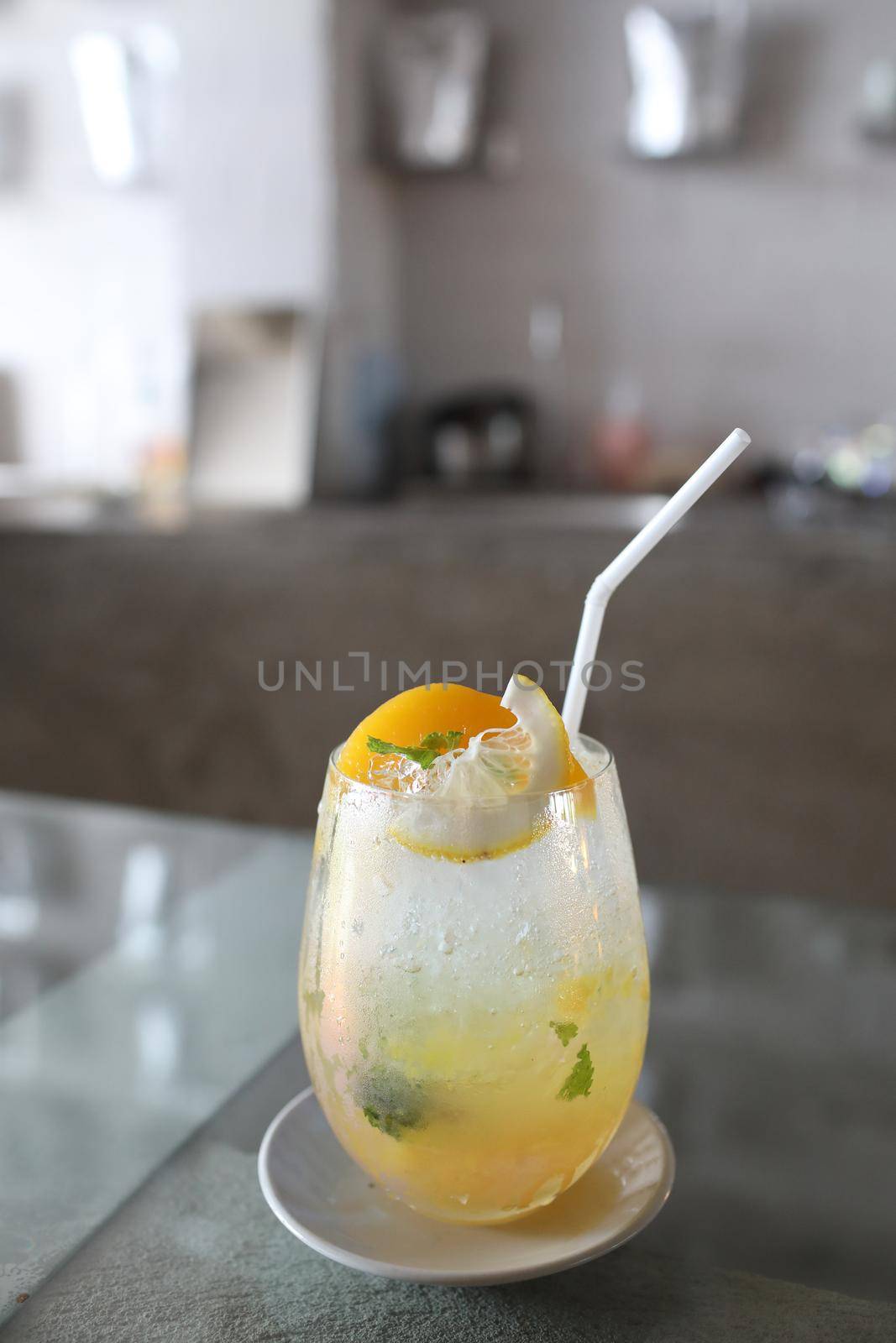 Yellow Cocktail glass with ice by piyato