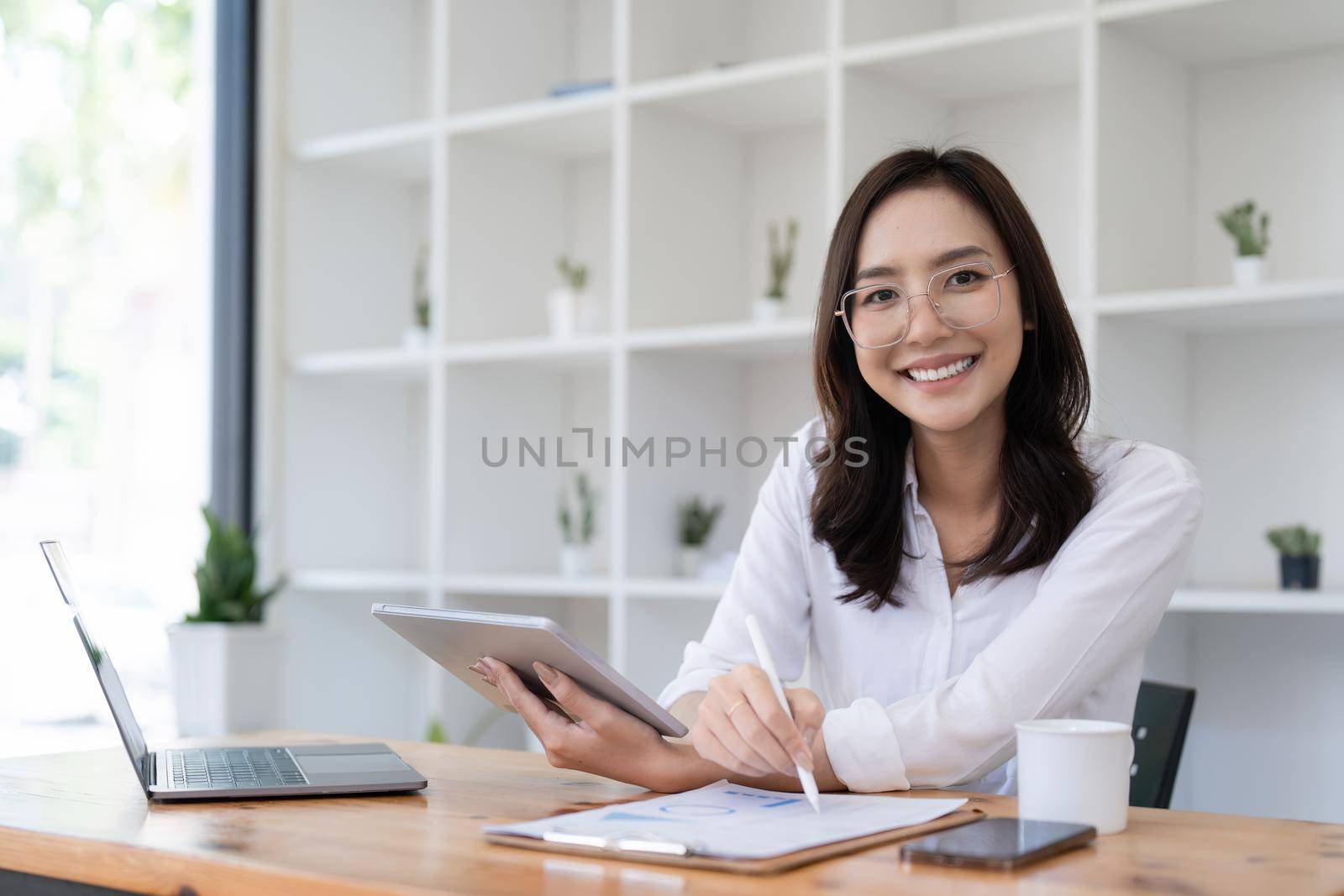 Smart asian business woman smiling at office space. real estate, lawyer, non-profit, marketing by itchaznong