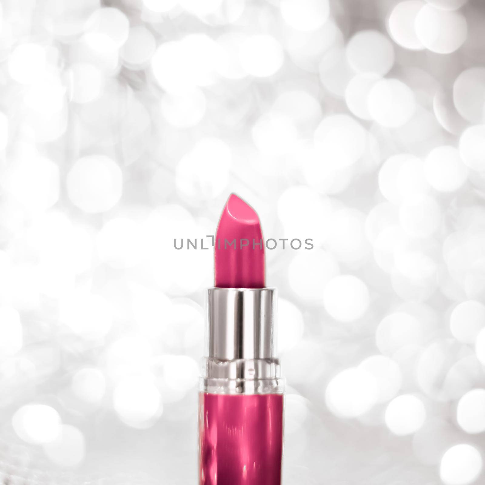 Pink lipstick on silver Christmas, New Years and Valentines Day holiday glitter background, make-up and cosmetics product for luxury beauty brand by Anneleven