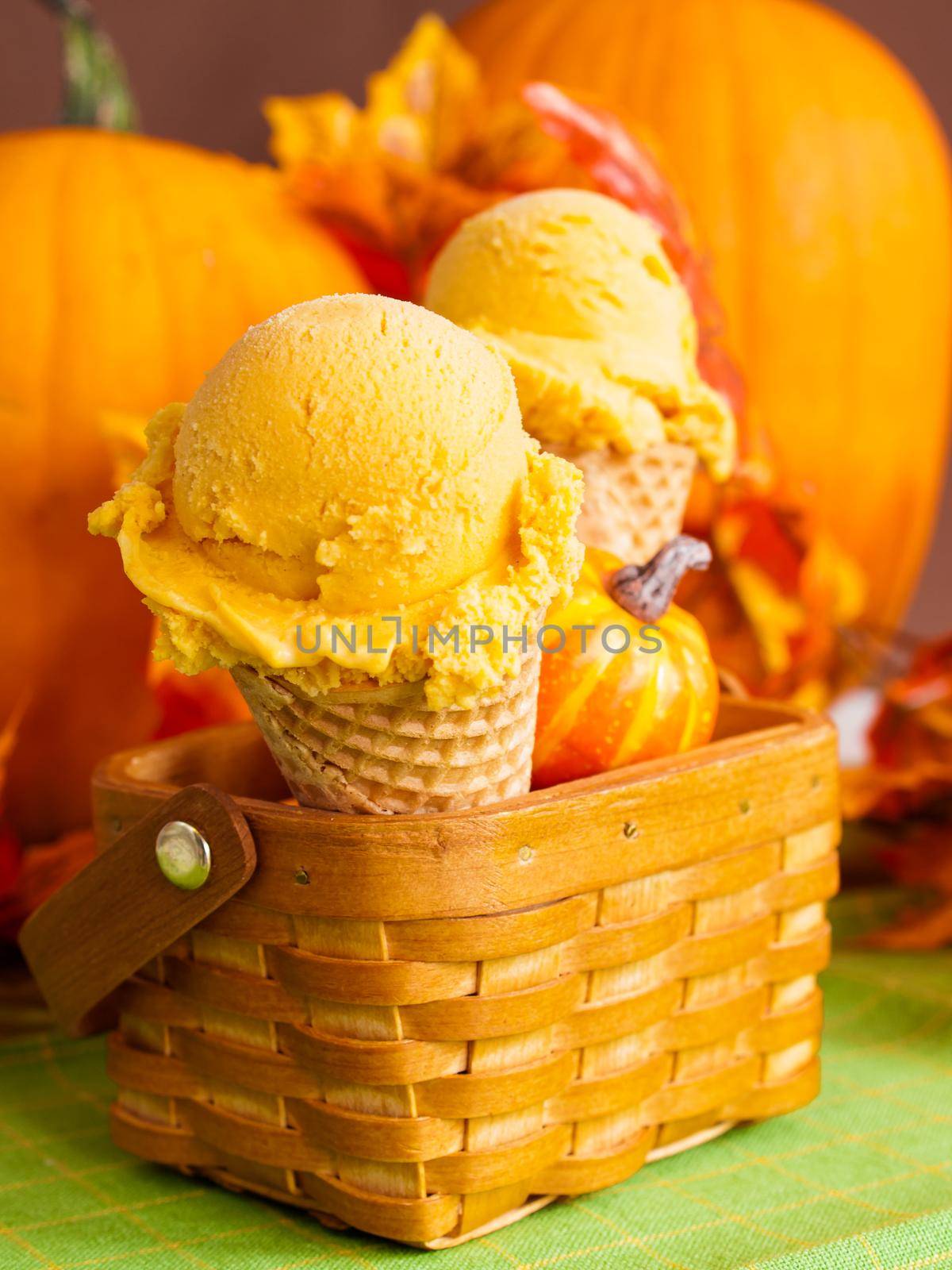 Scoop of gourmet pumpkin gelato in waffle cones.