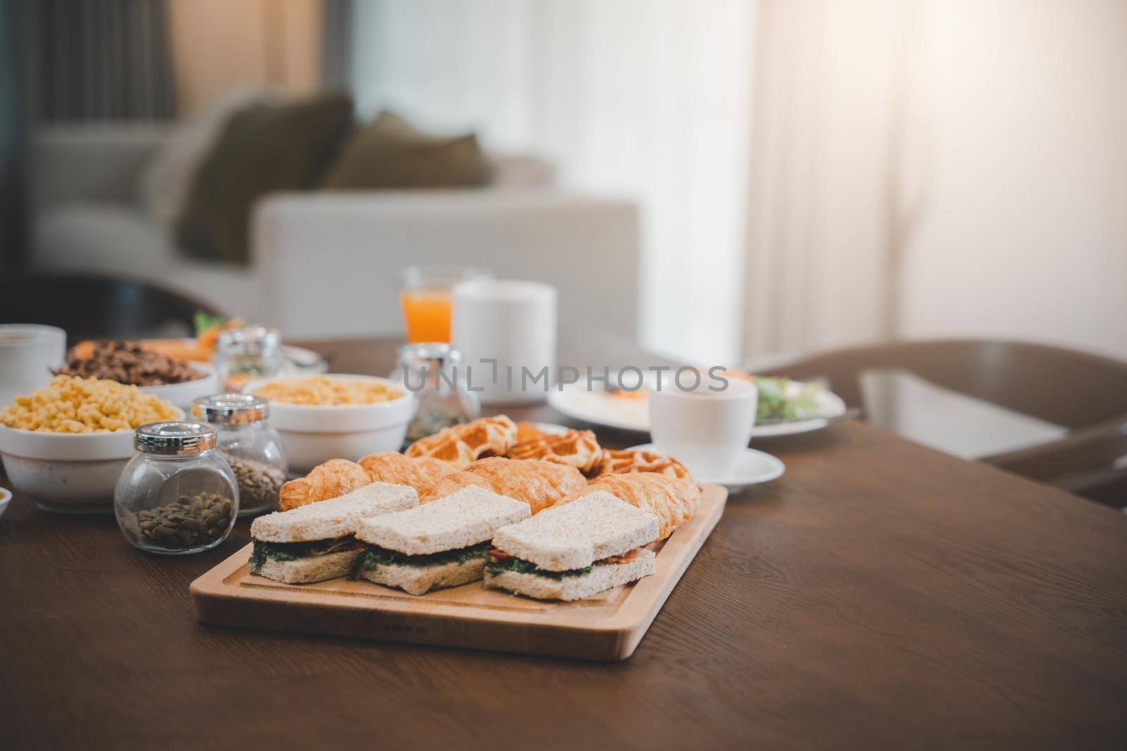 Breakfast served food with beverage coffee, orange juice on table in the morning at home by Sorapop