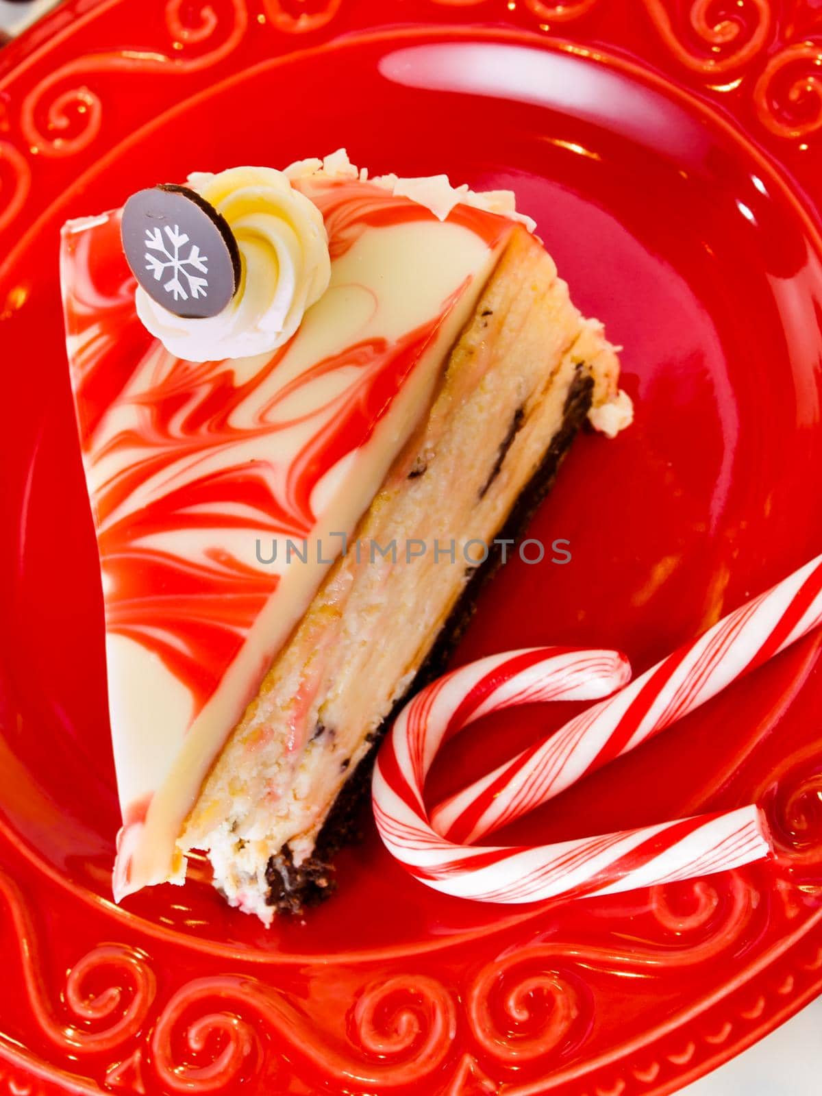 Traditional Christmas White Chocolate Peppermint Cheesecake on white background.